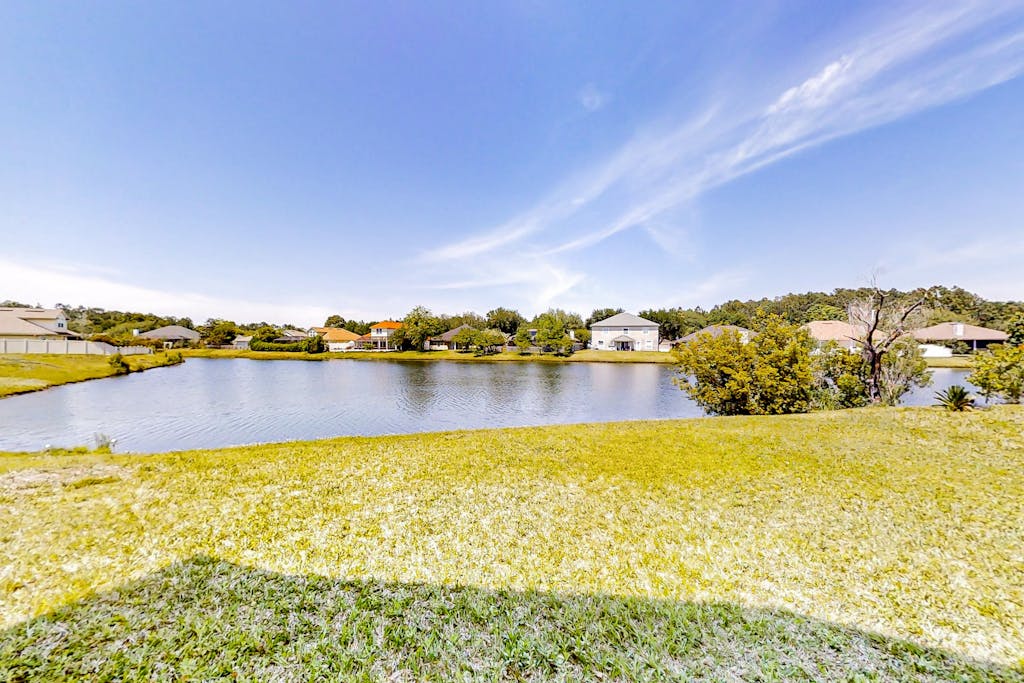 Waterfront 2-story home with water views, patio, streaming, washer/dryer, & AC