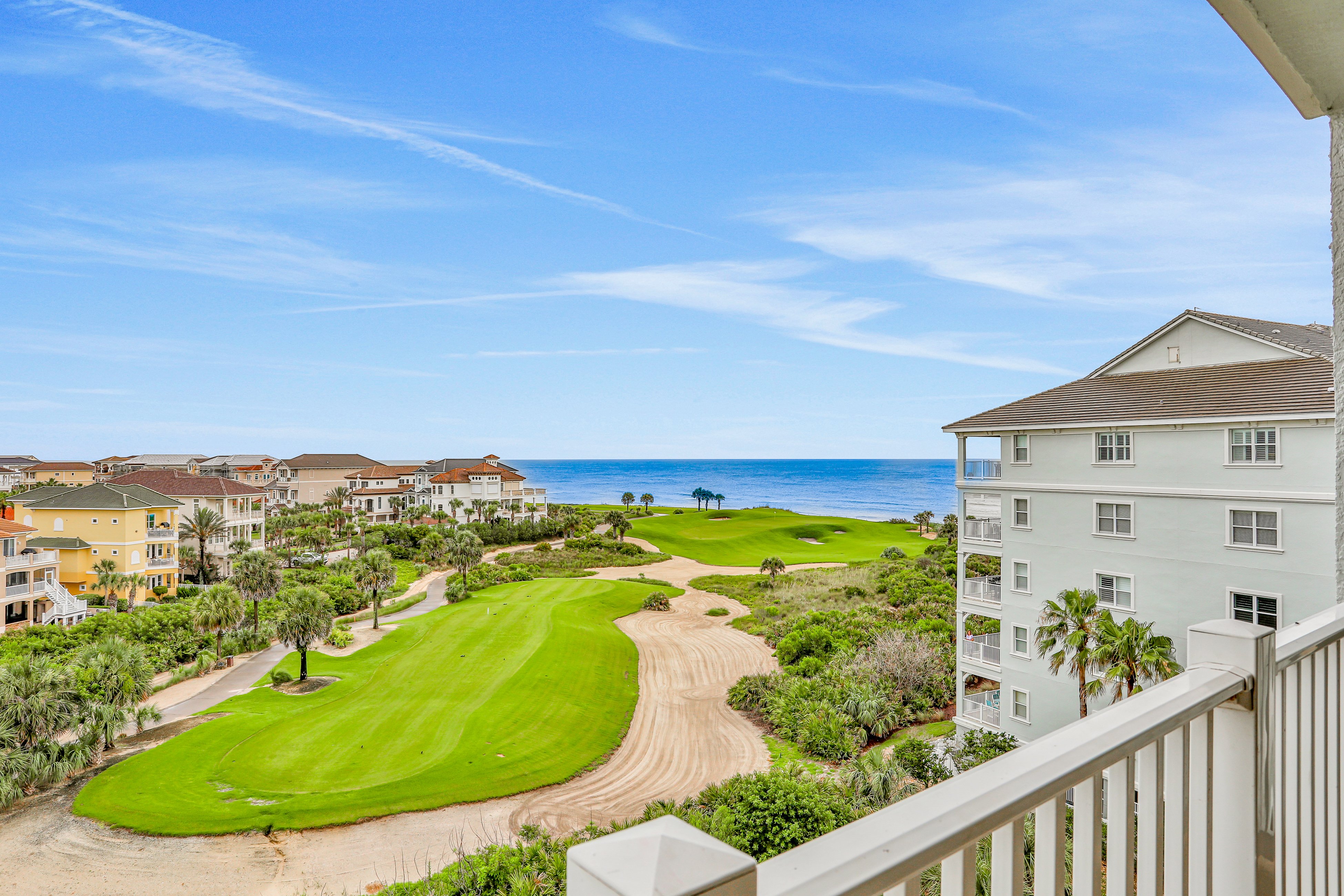 Dog-friendly condo on the golf course with ocean view, pools, gym & beach access