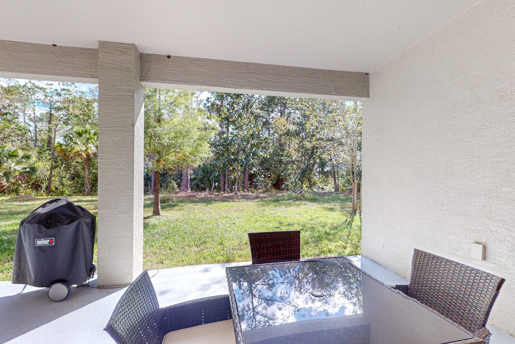 Dog-friendly home with Tesla EV charger, yard, patio, grill, AC, & W/D