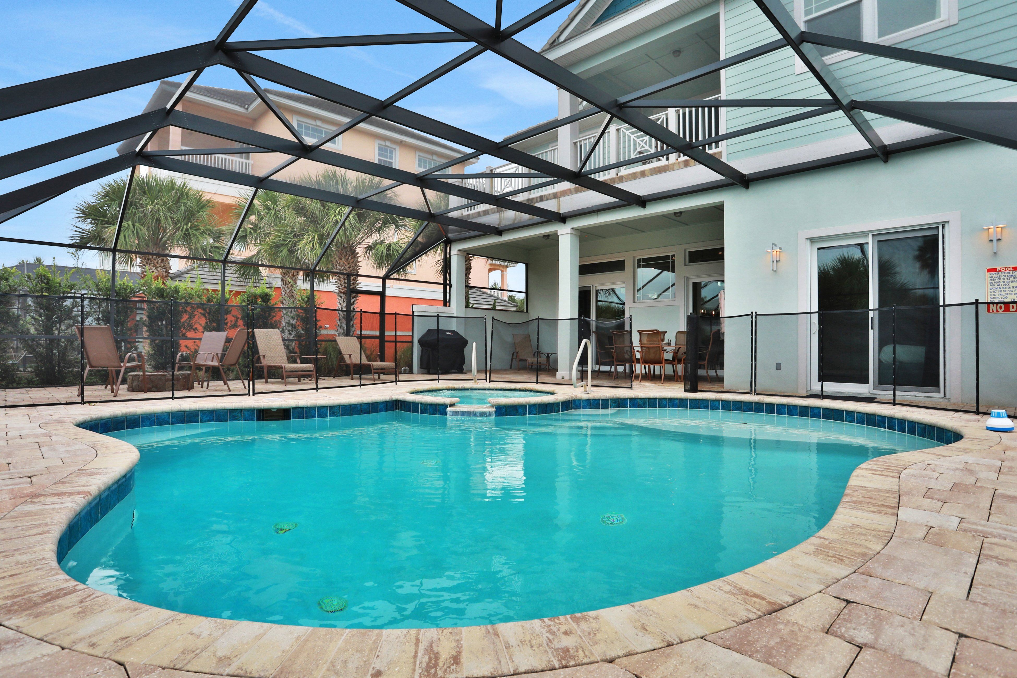 Palm-surrounded stunner with enclosed pool & water views - dog-friendly