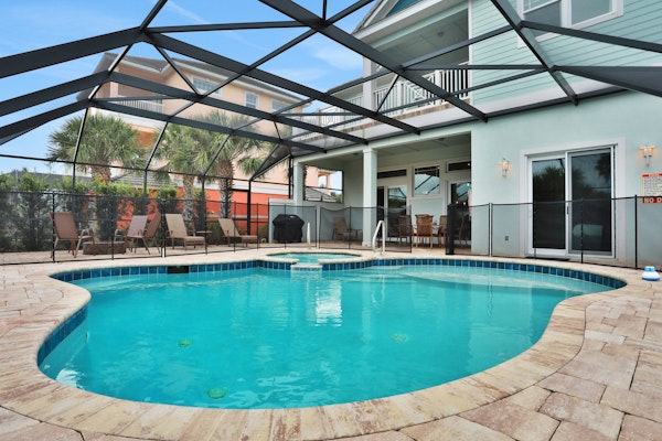 Palm-surrounded stunner with enclosed pool & water views - dog-friendly