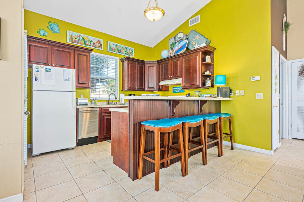 Two-level home with partial ocean view, balcony, WiFi, & W/D - walk to the beach
