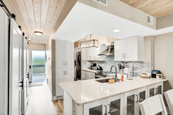 Modern oceanview condo with multiple balconies, pool & W/D - beach access