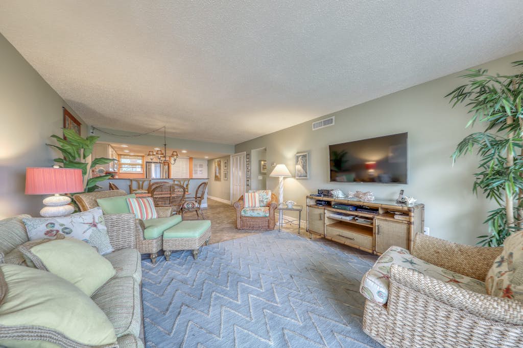 Island-themed living with furnished patio, shared pool & beach access