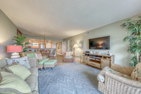 Island-themed living with furnished patio, shared pool & beach access