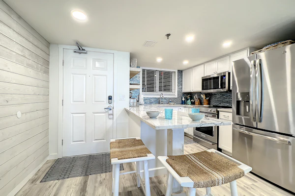 Bright 2BR beachfront condo with balcony, pool & ocean views