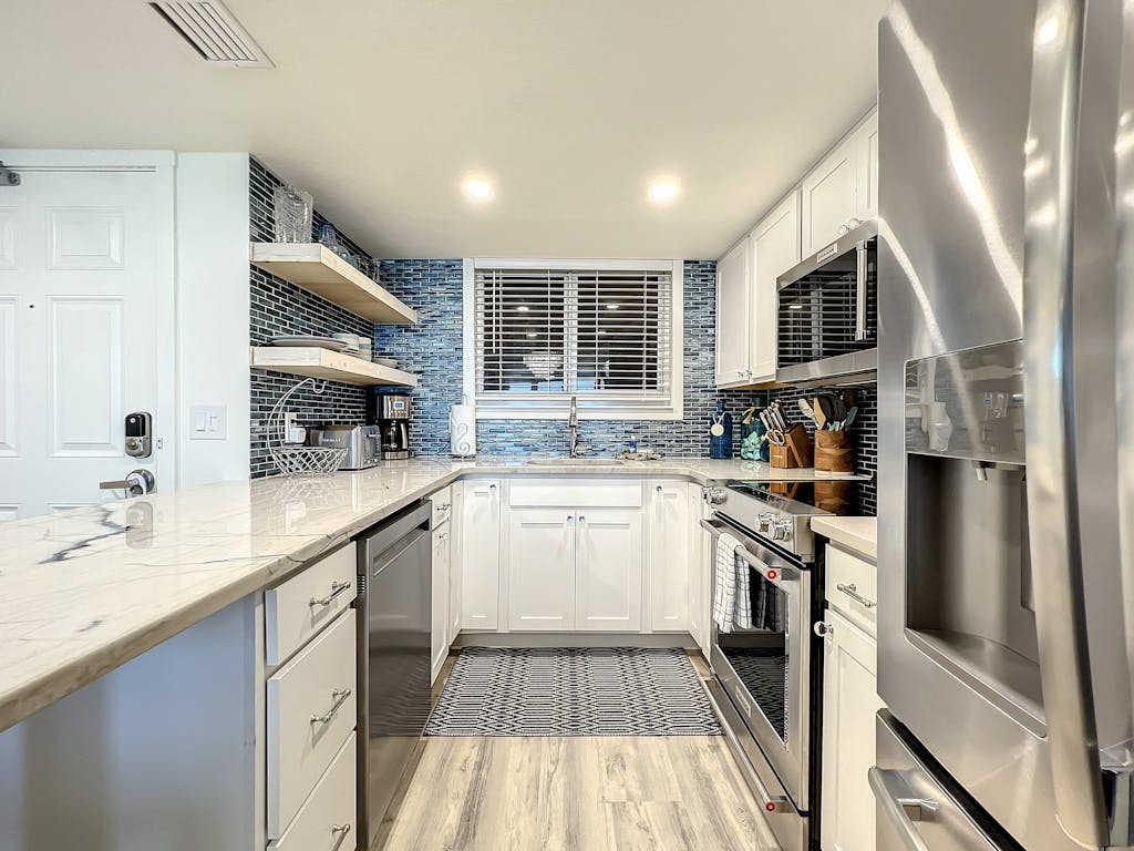 Bright 2BR beachfront condo with balcony, pool & ocean views