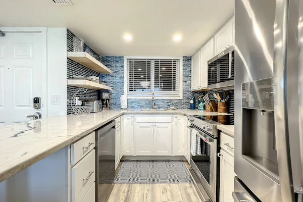 Bright 2BR beachfront condo with balcony, pool & ocean views