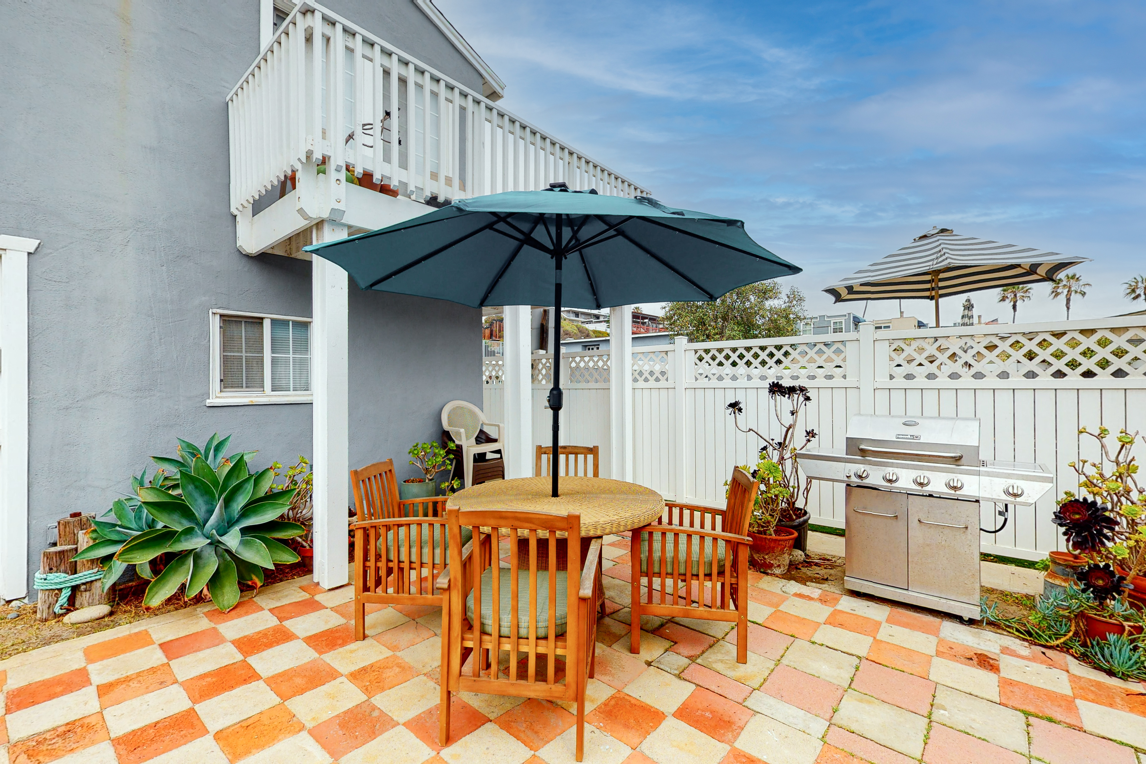 The Strand Cottage Beachfront beauty steps from the sand with views, vibes, and a private BBQ patio