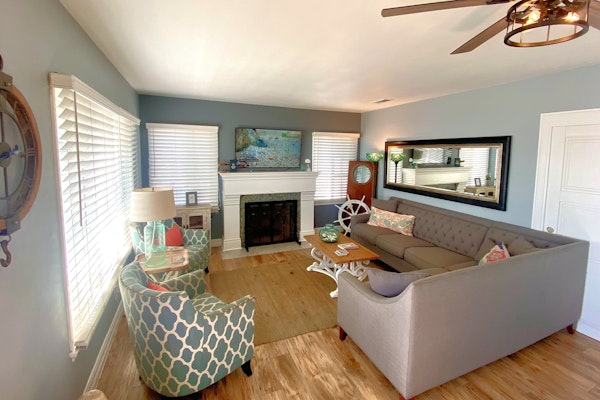 The Strand Cottage Beachfront beauty steps from the sand with views, vibes, and a private BBQ patio