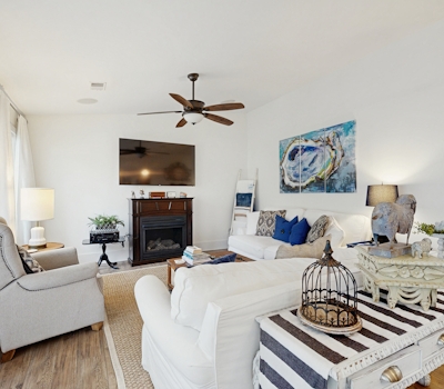 Breezy, renovated home with fenced yard, front porch & lovely living spaces