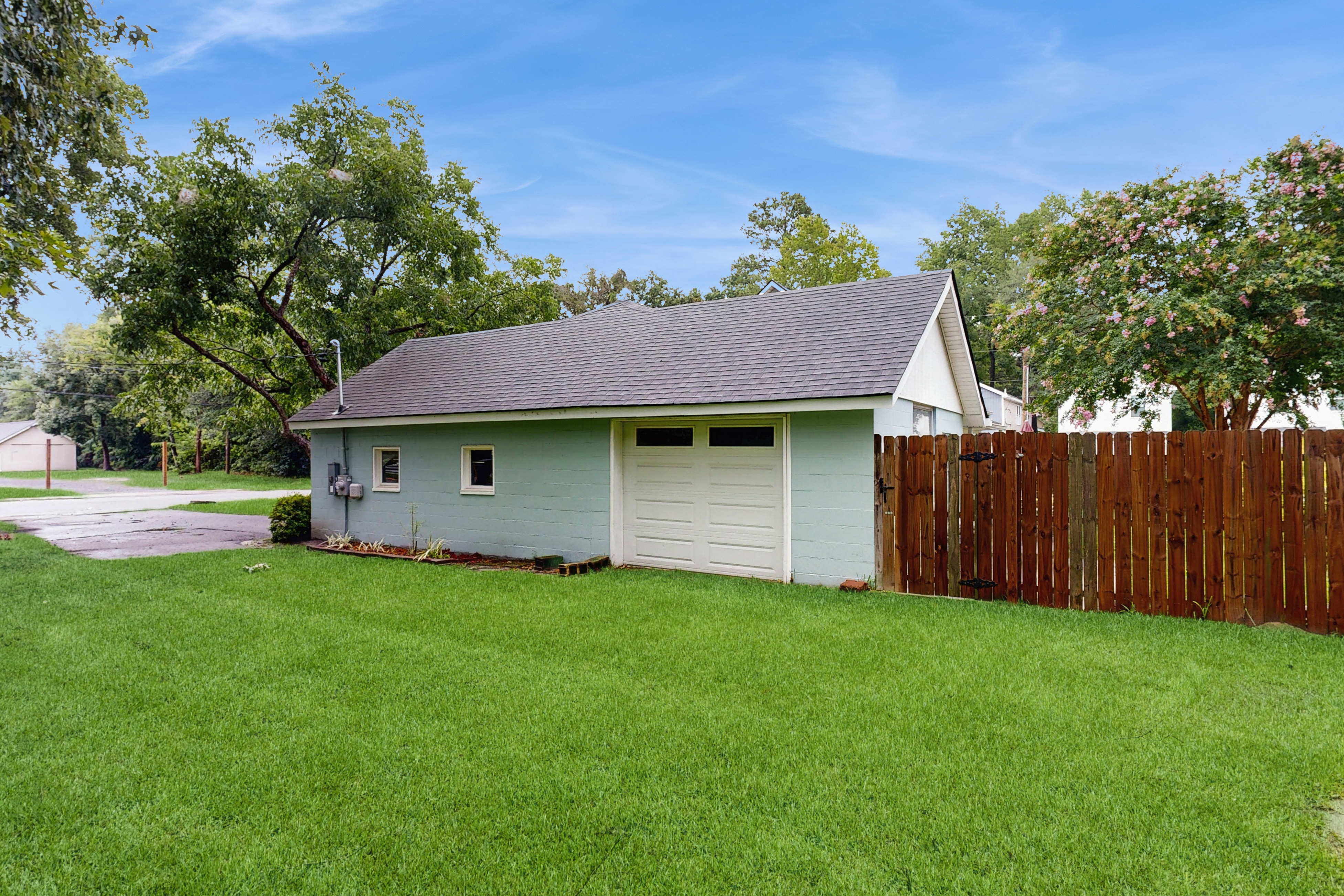 Breezy, renovated home with fenced yard, front porch & lovely living spaces