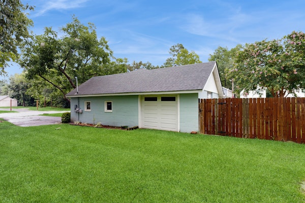 Breezy, renovated home with fenced yard, front porch & lovely living spaces