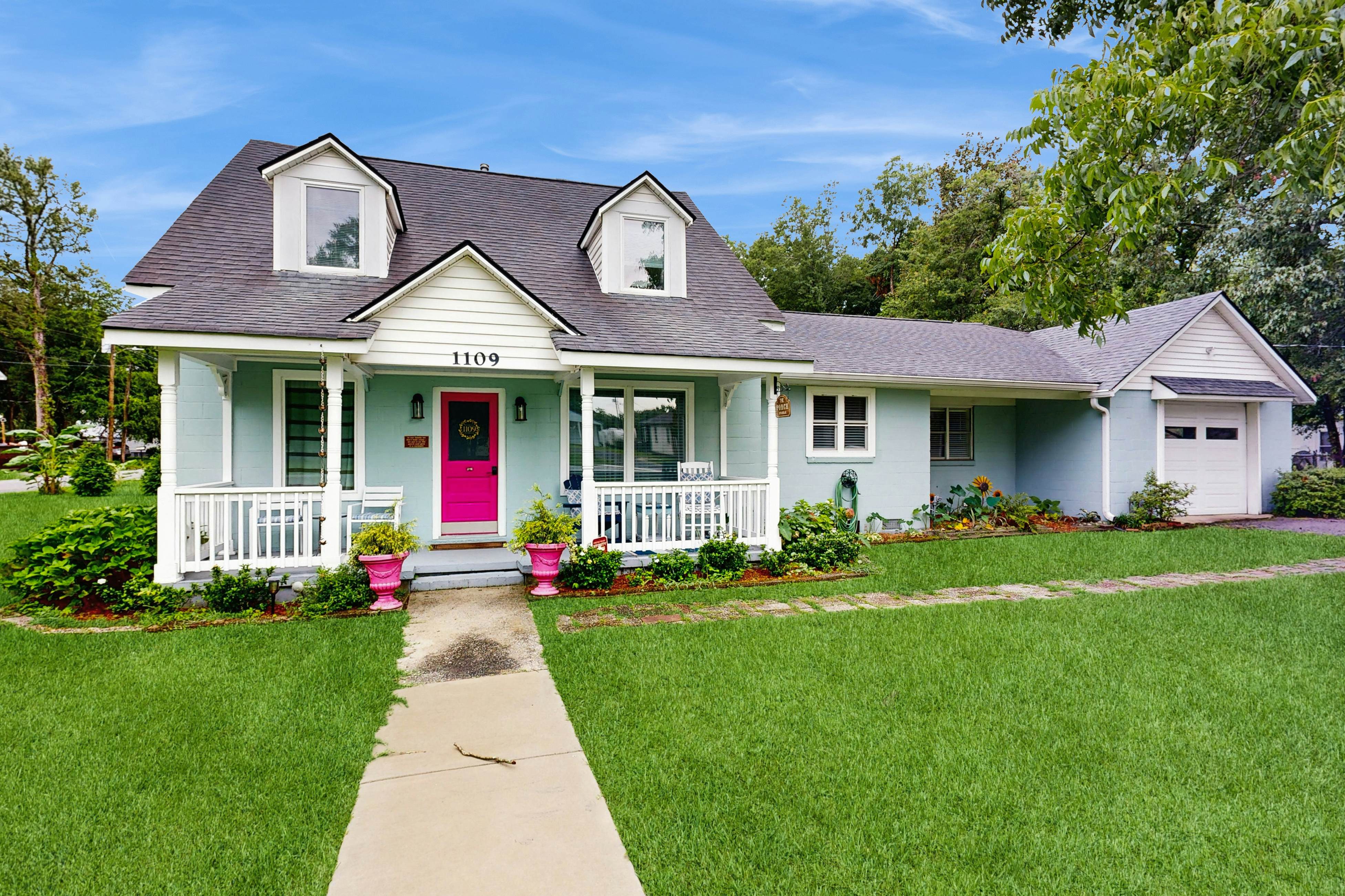 Breezy, renovated home with fenced yard, front porch & lovely living spaces