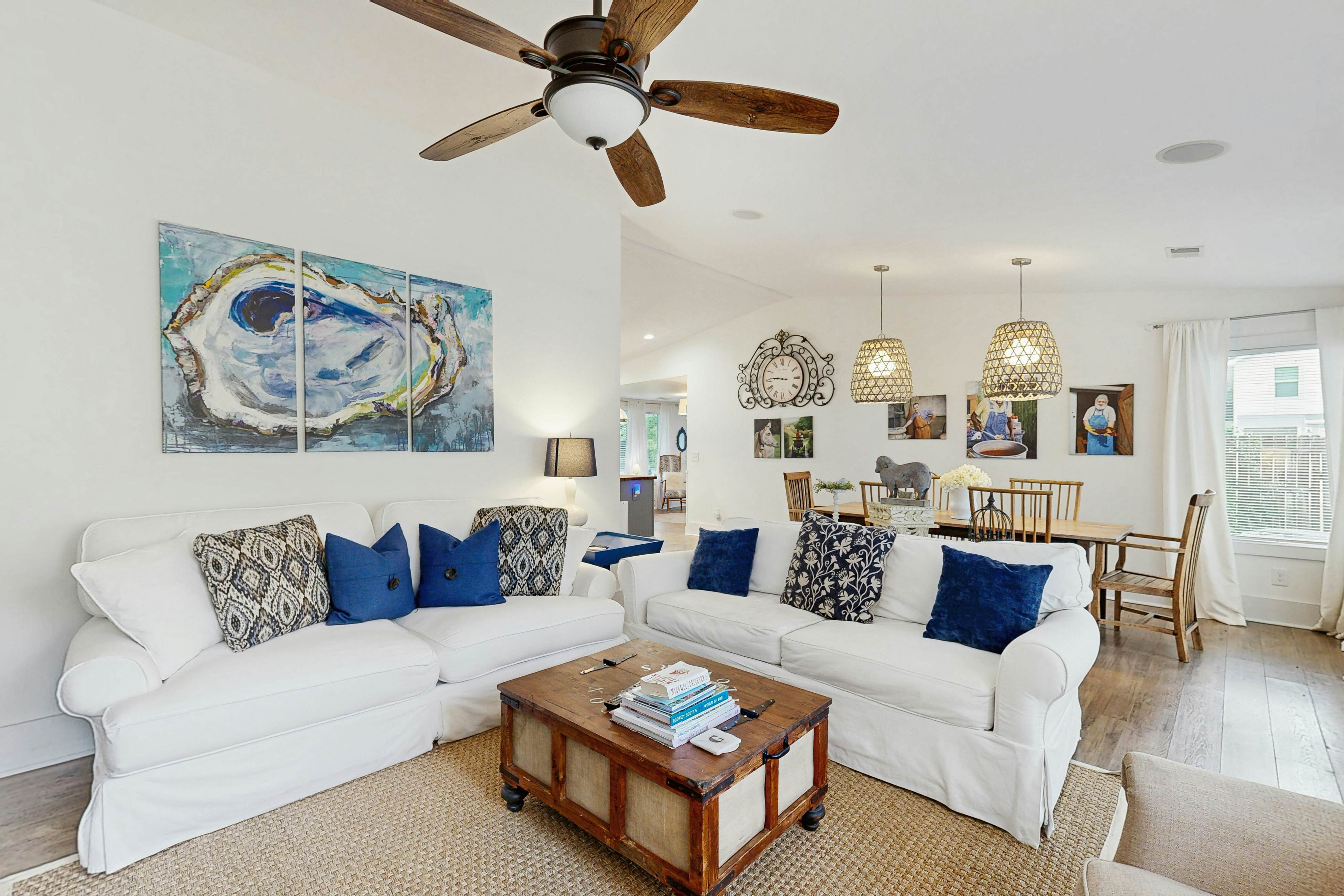 Breezy, renovated home with fenced yard, front porch & lovely living spaces