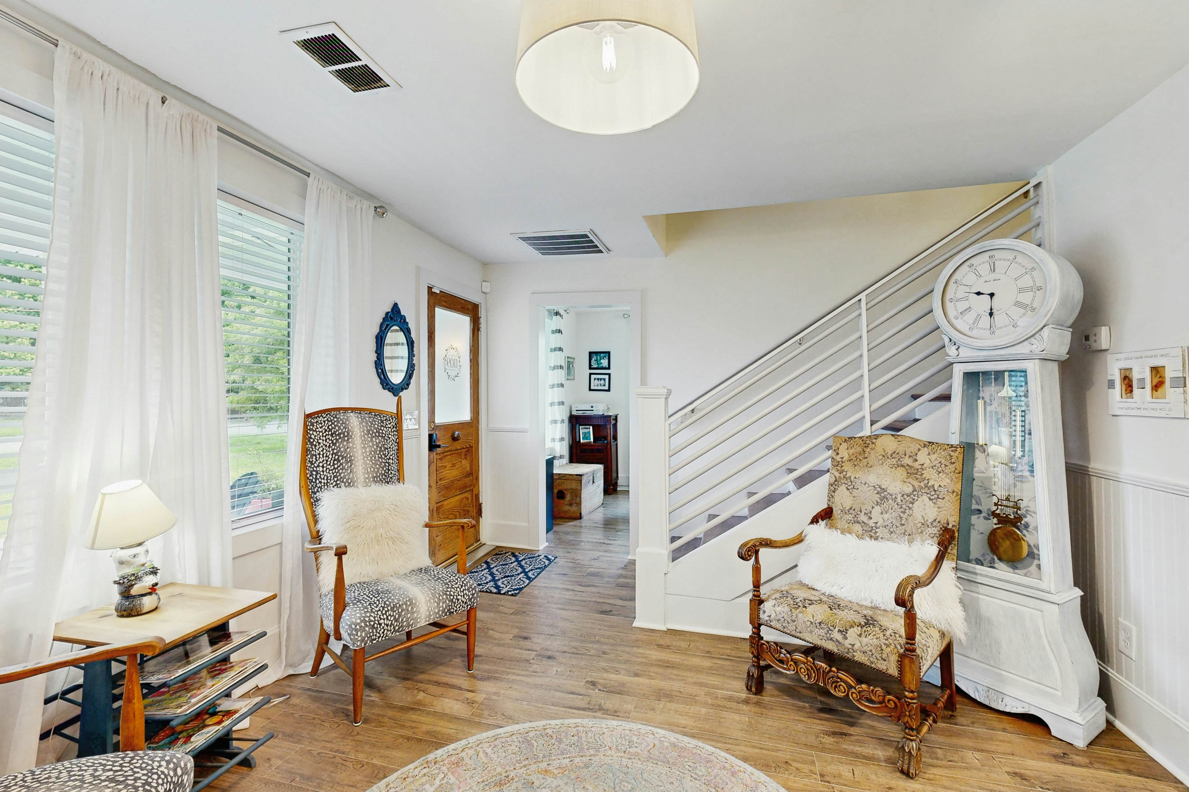 Breezy, renovated home with fenced yard, front porch & lovely living spaces