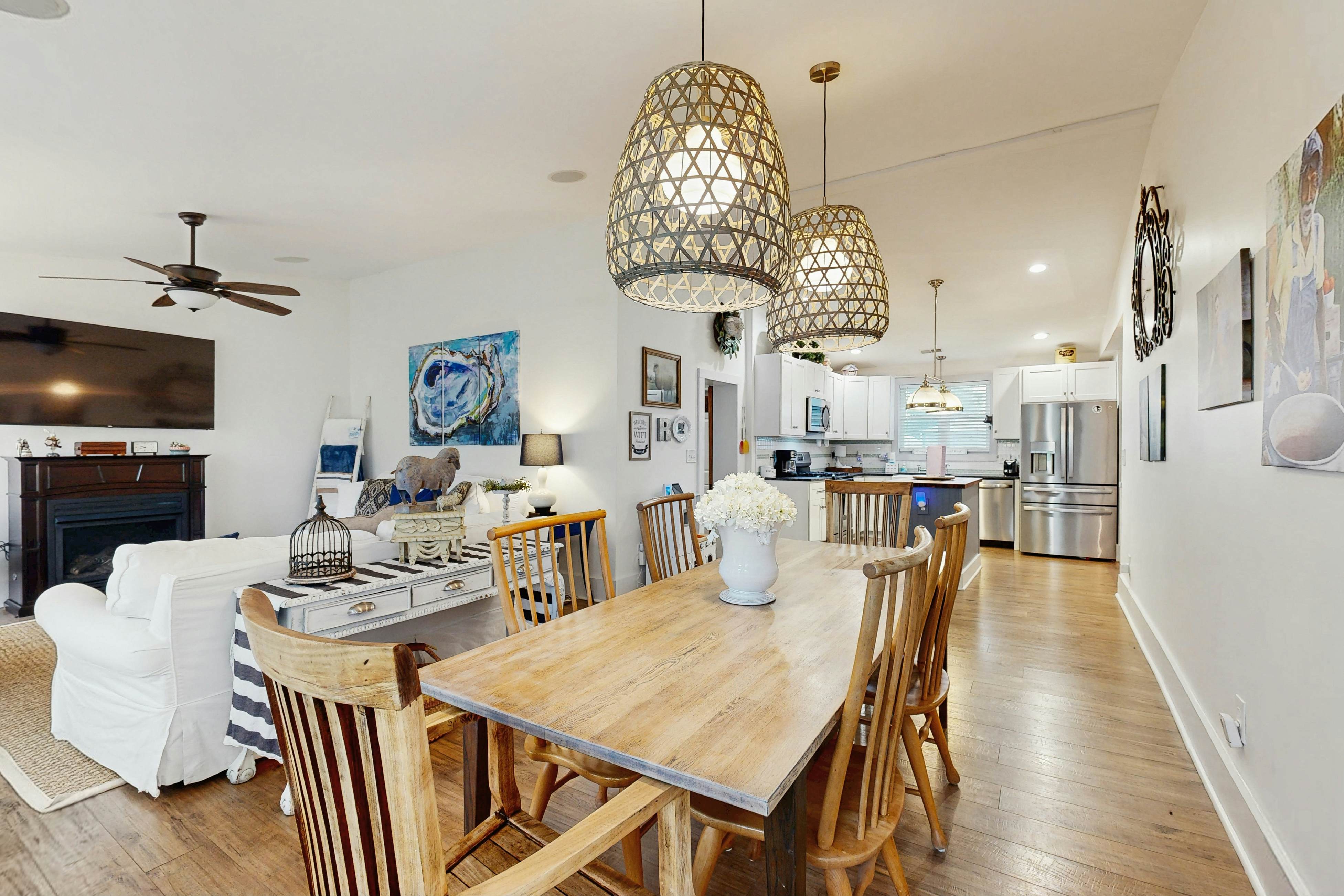 Breezy, renovated home with fenced yard, front porch & lovely living spaces