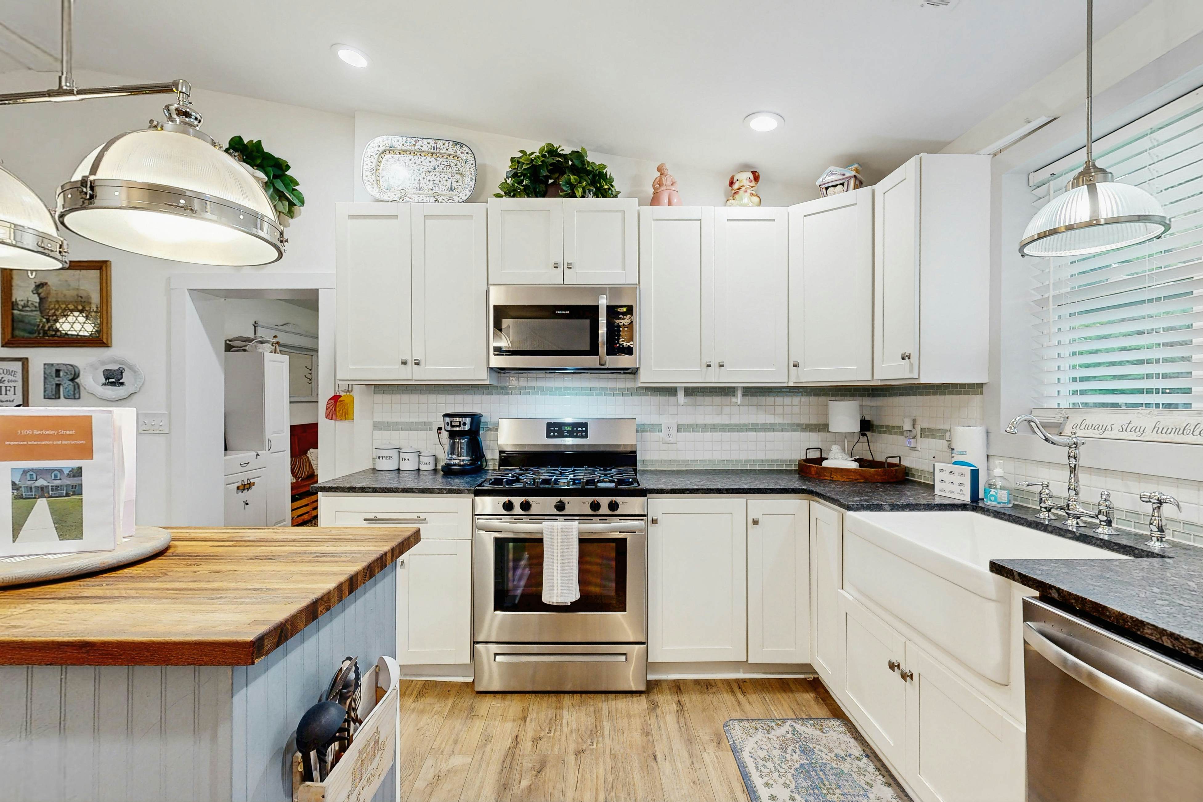 Breezy, renovated home with fenced yard, front porch & lovely living spaces