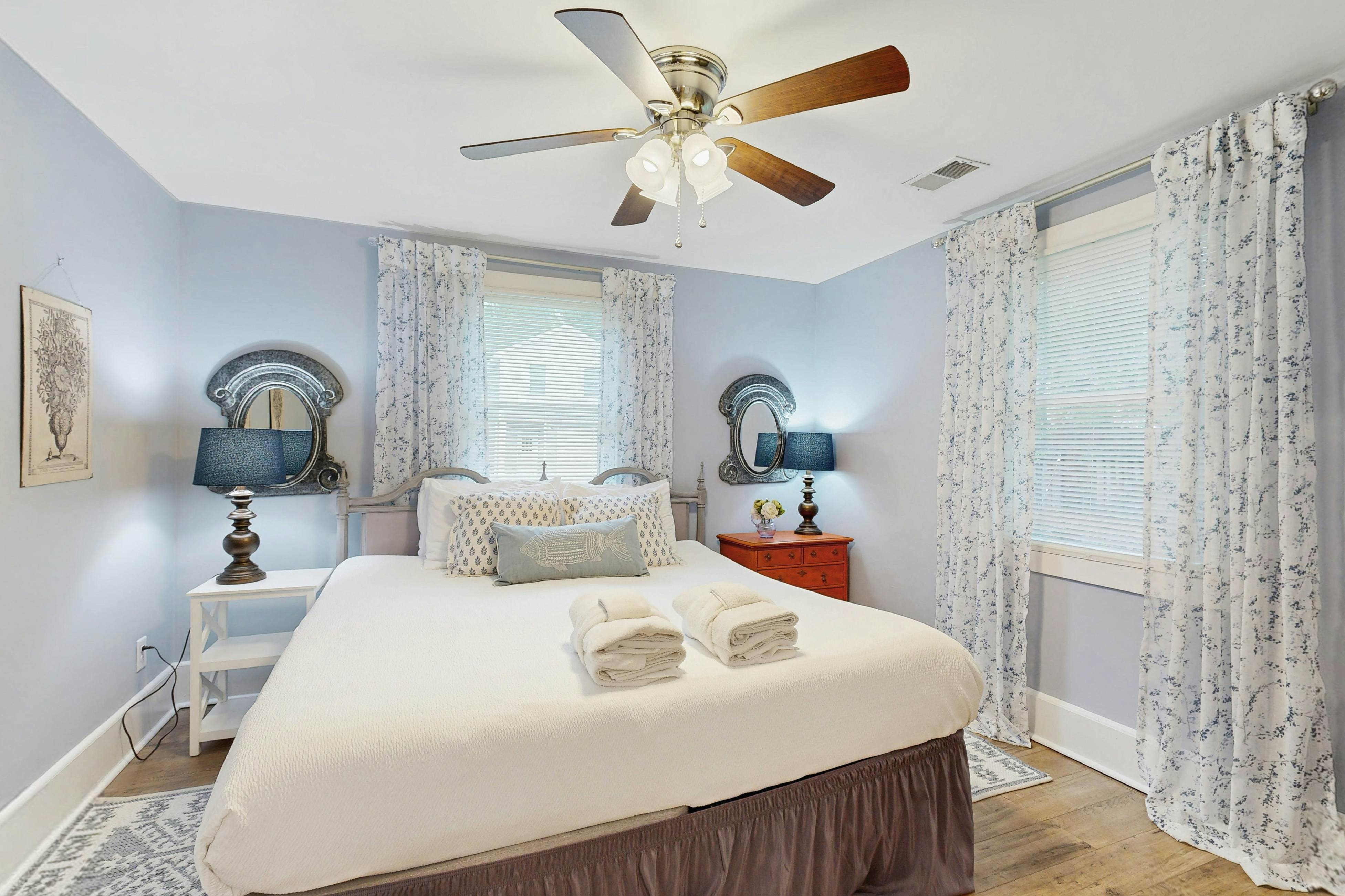 Breezy, renovated home with fenced yard, front porch & lovely living spaces