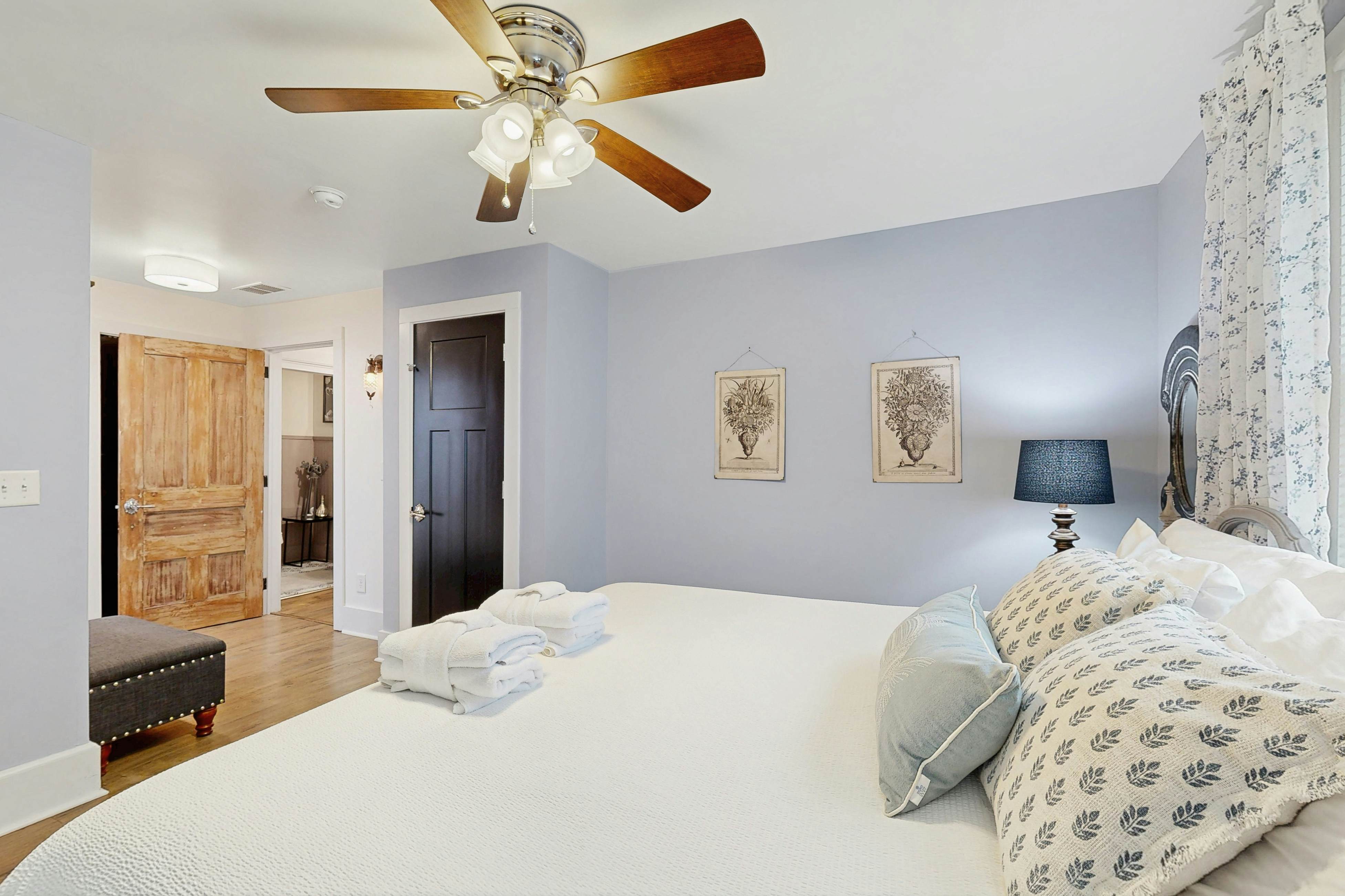 Breezy, renovated home with fenced yard, front porch & lovely living spaces