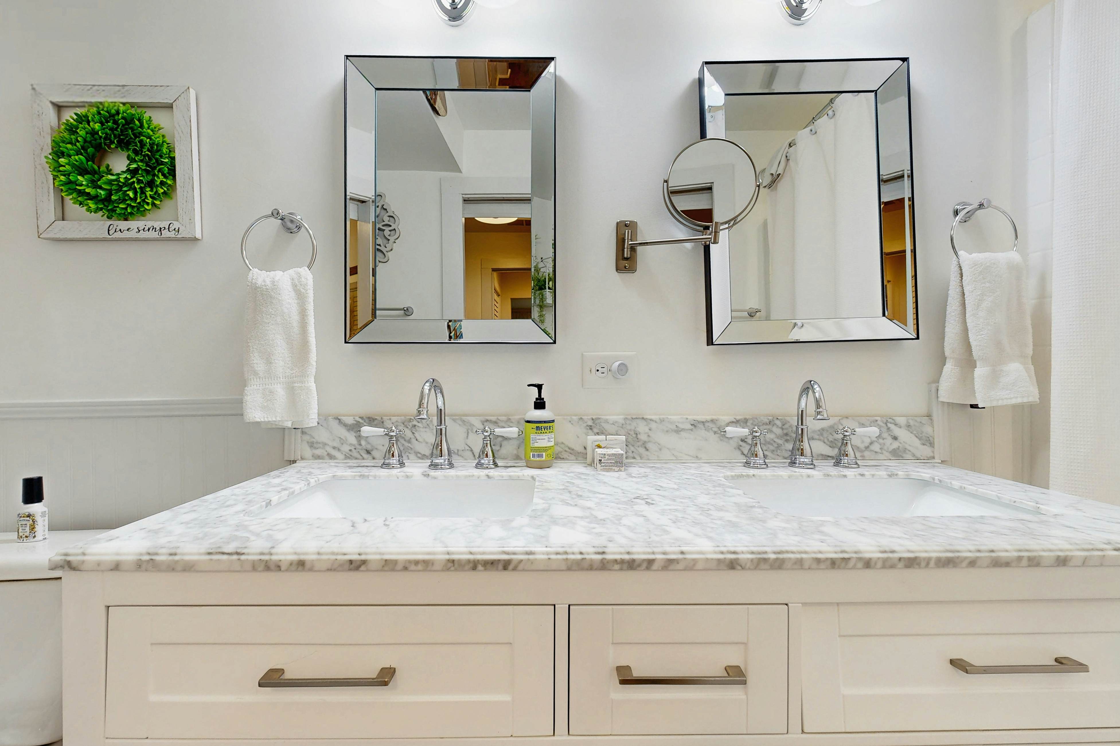 Breezy, renovated home with fenced yard, front porch & lovely living spaces