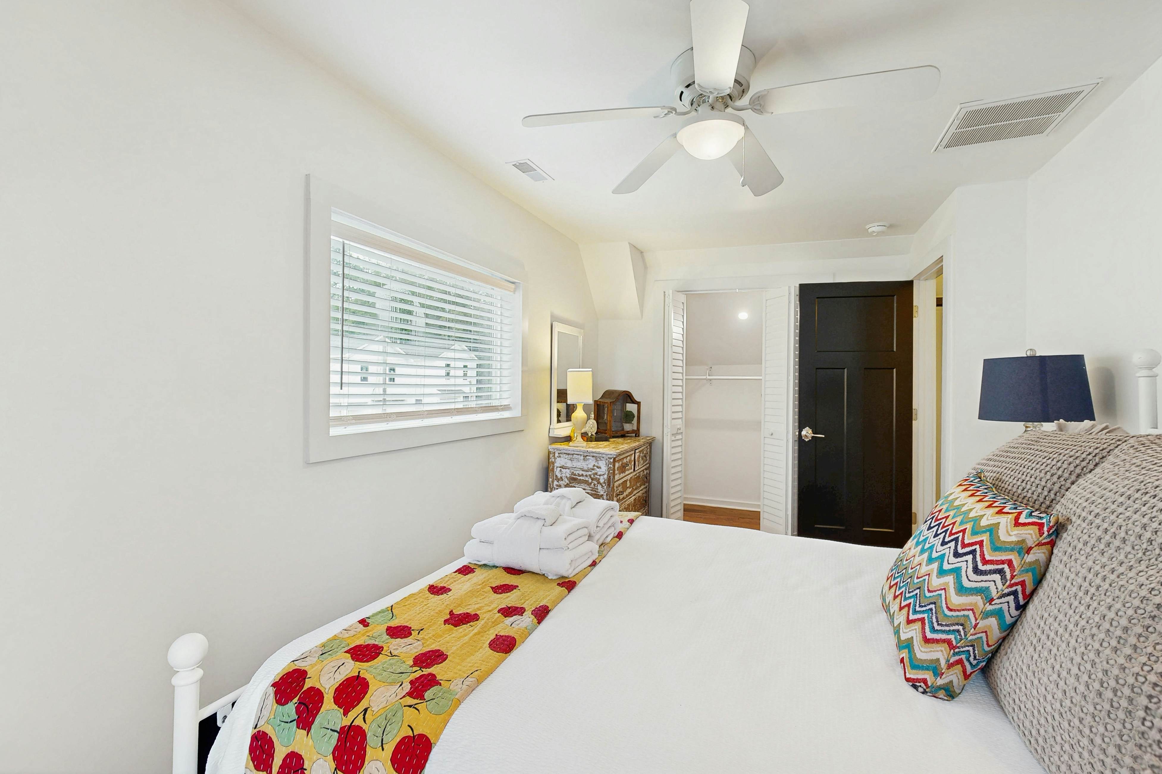 Breezy, renovated home with fenced yard, front porch & lovely living spaces