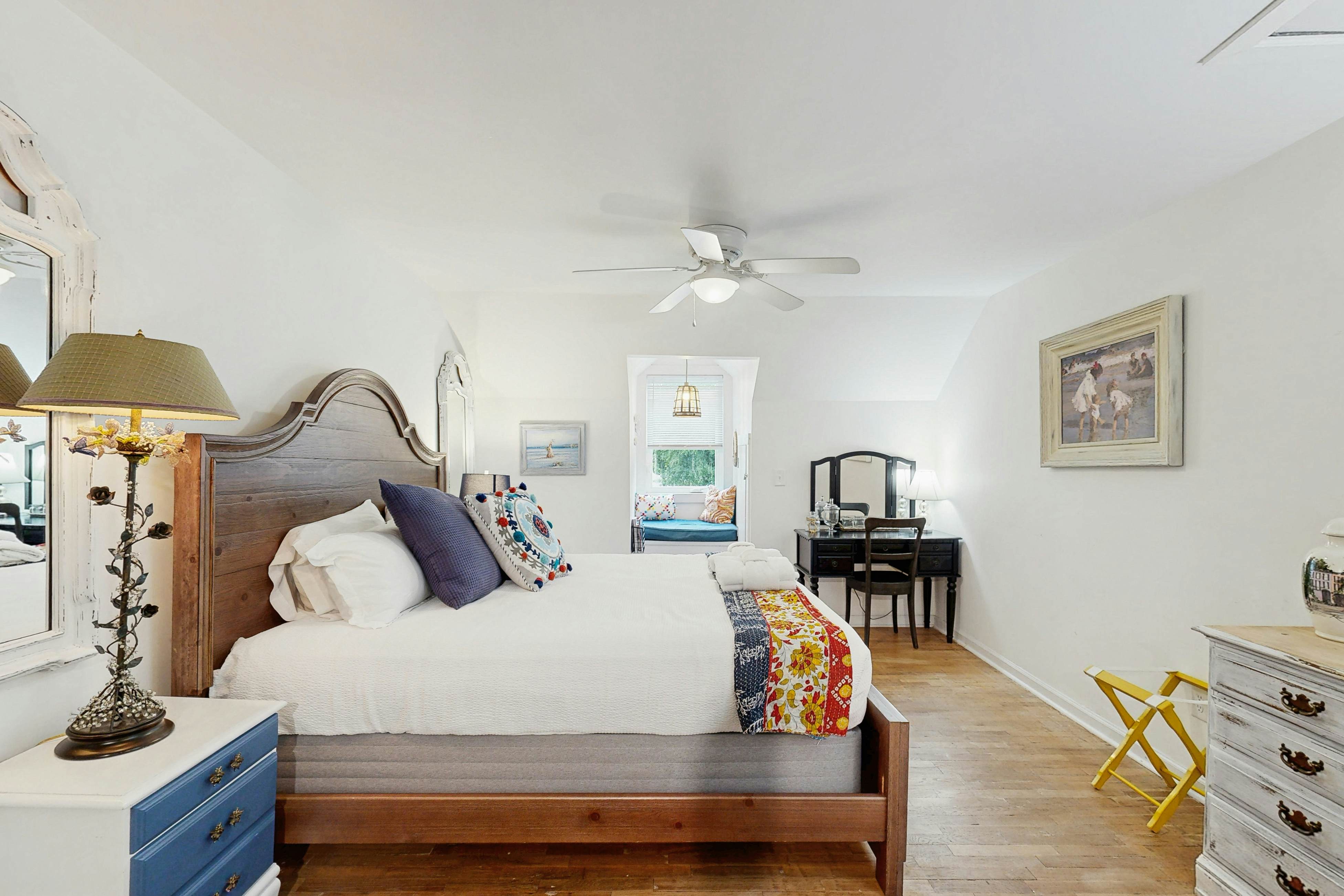 Breezy, renovated home with fenced yard, front porch & lovely living spaces