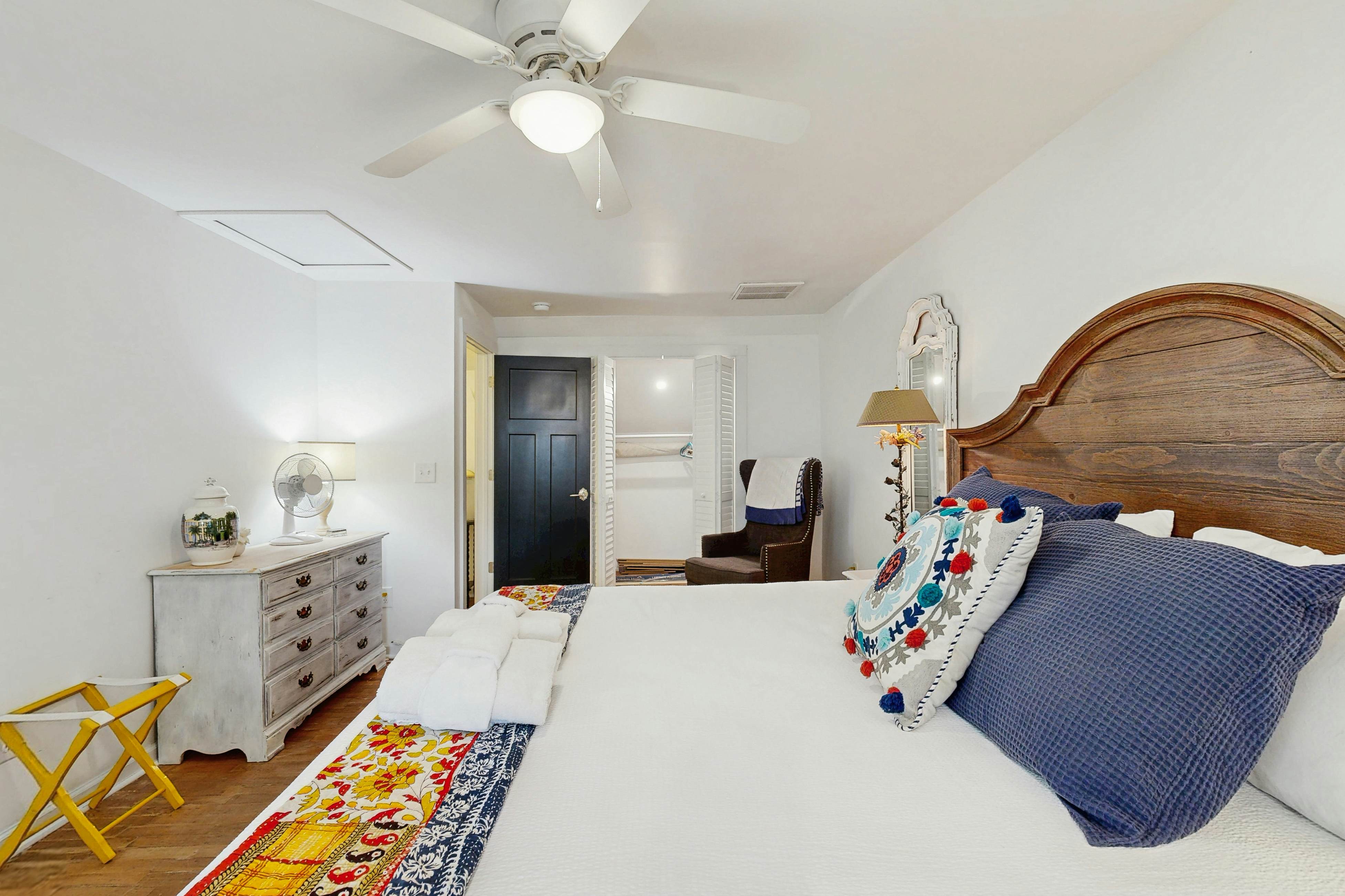 Breezy, renovated home with fenced yard, front porch & lovely living spaces