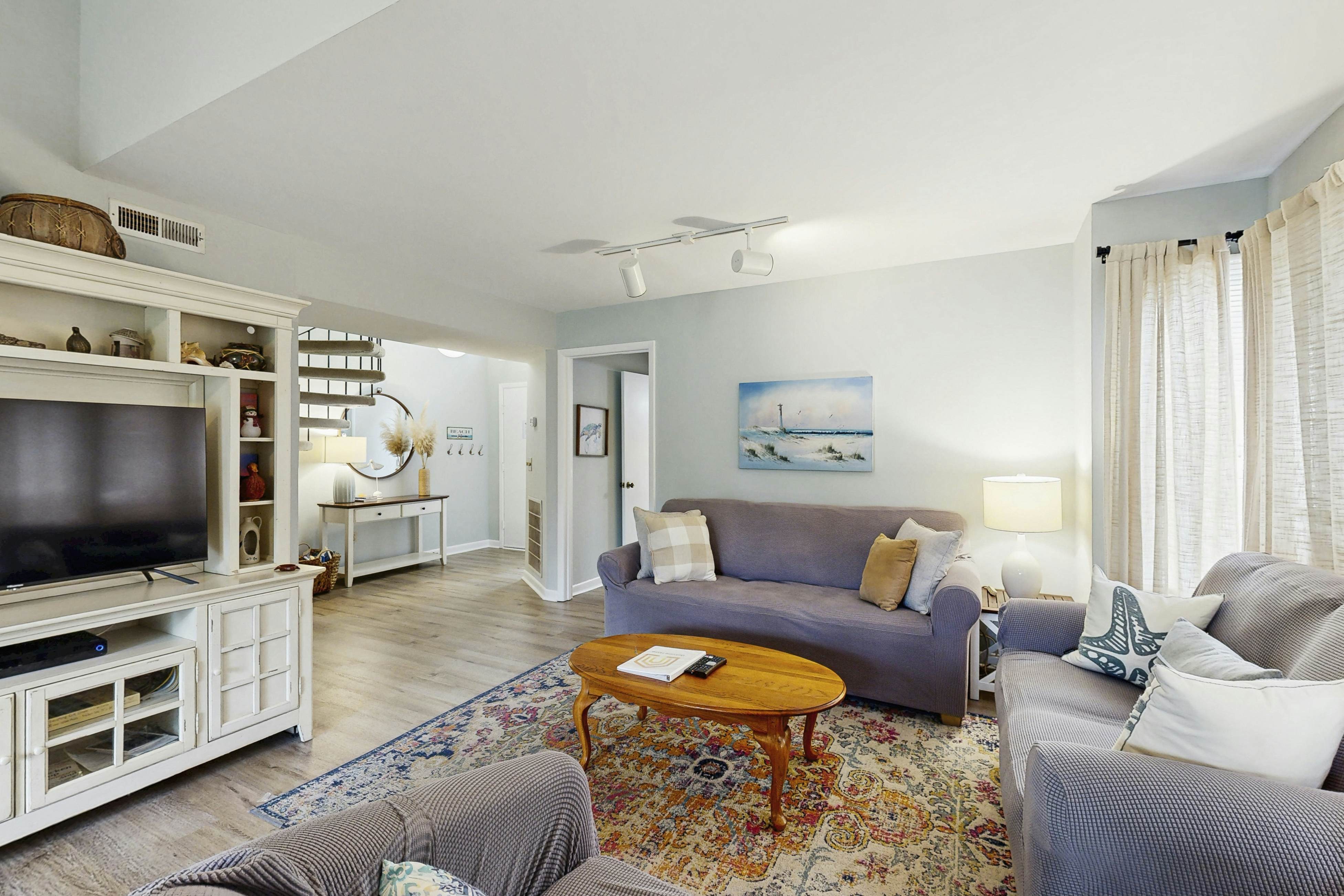 Dog-friendly, riverfront condo w/ shared pool plus access to tennis & gym