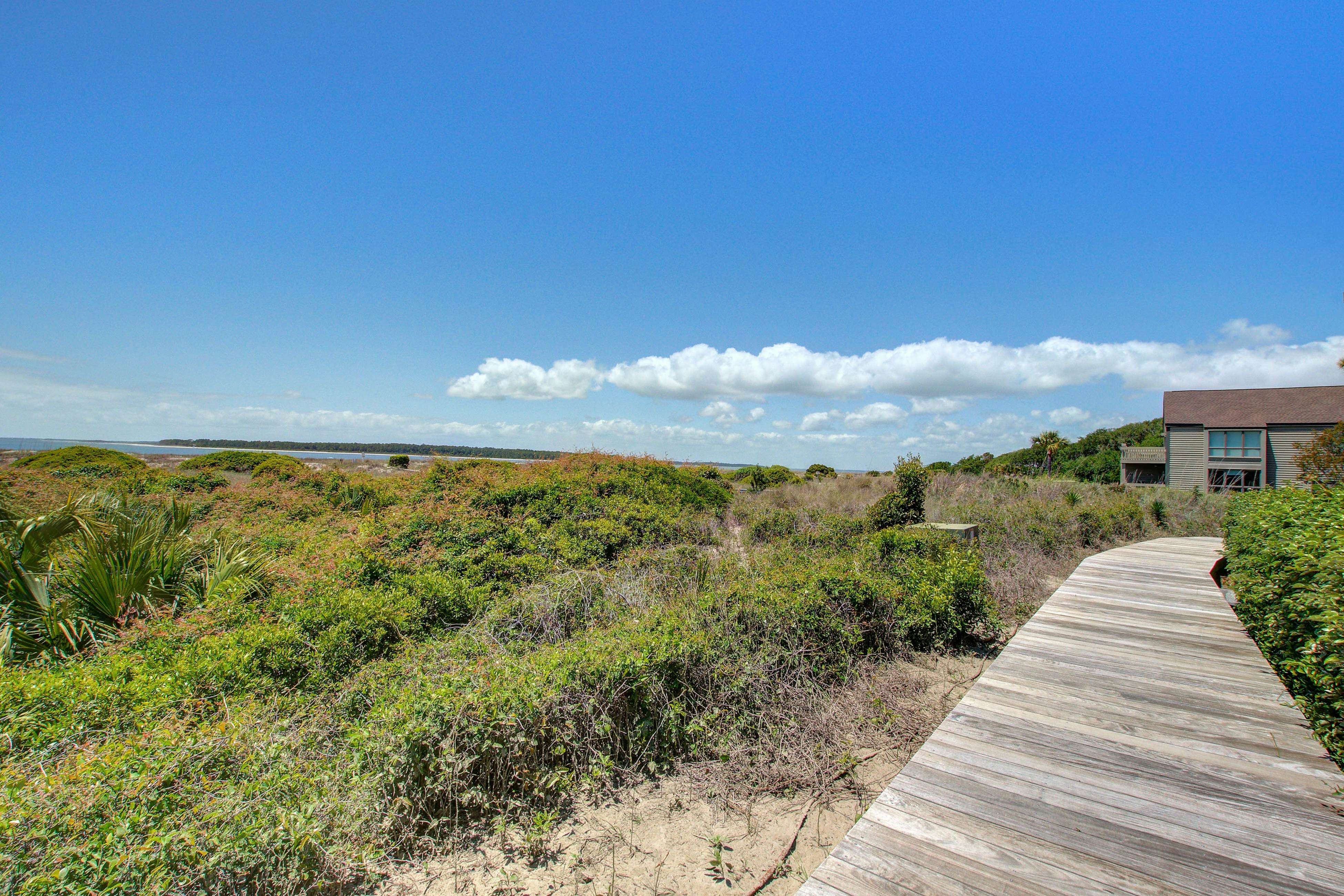 Beachfront villa with dolphin viewing deck, shared pools, tennis, golf & more