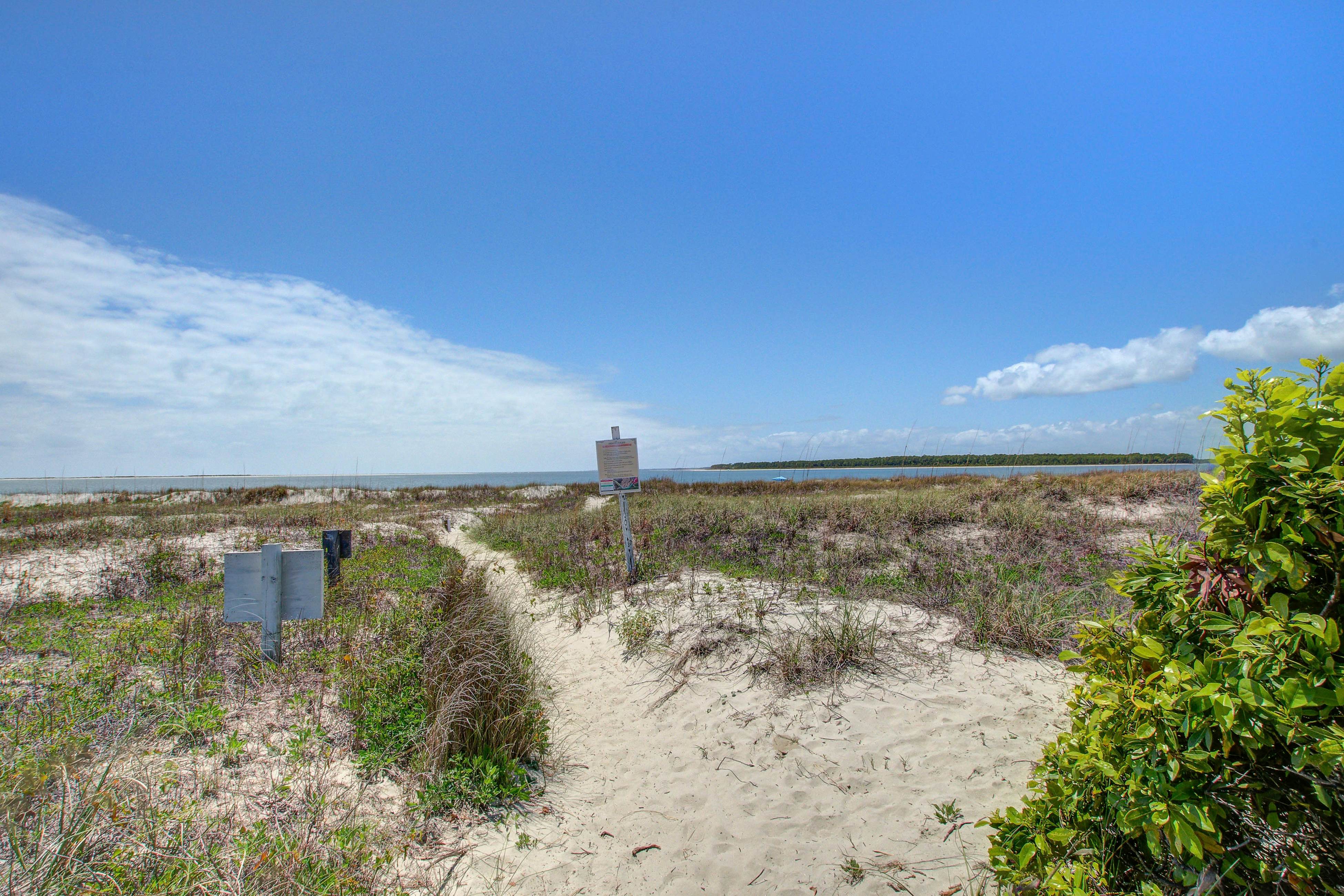 Beachfront villa with dolphin viewing deck, shared pools, tennis, golf & more