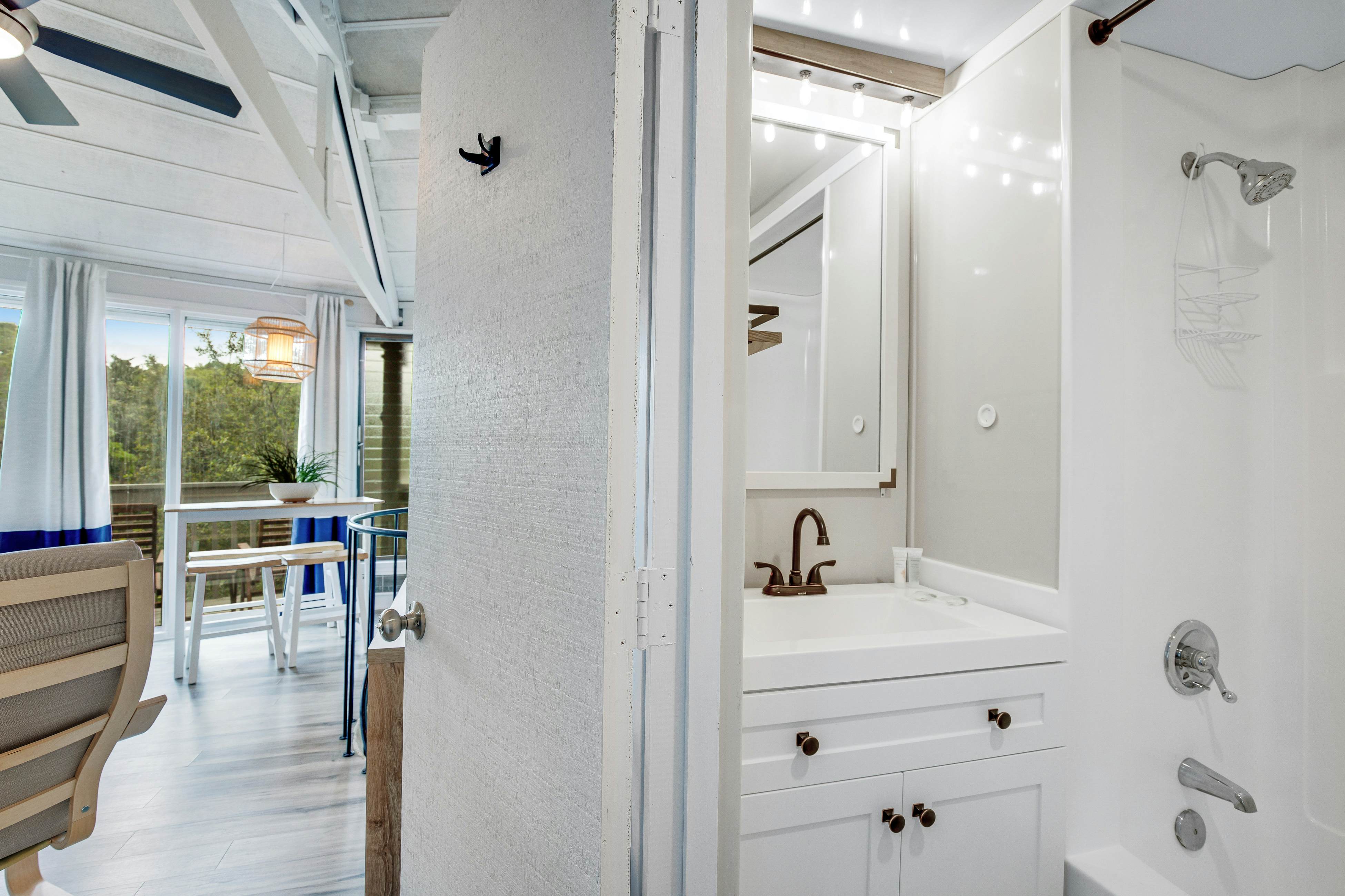 Lakefront home with lagoon view, deck & AC - close to beach, golf, & pools