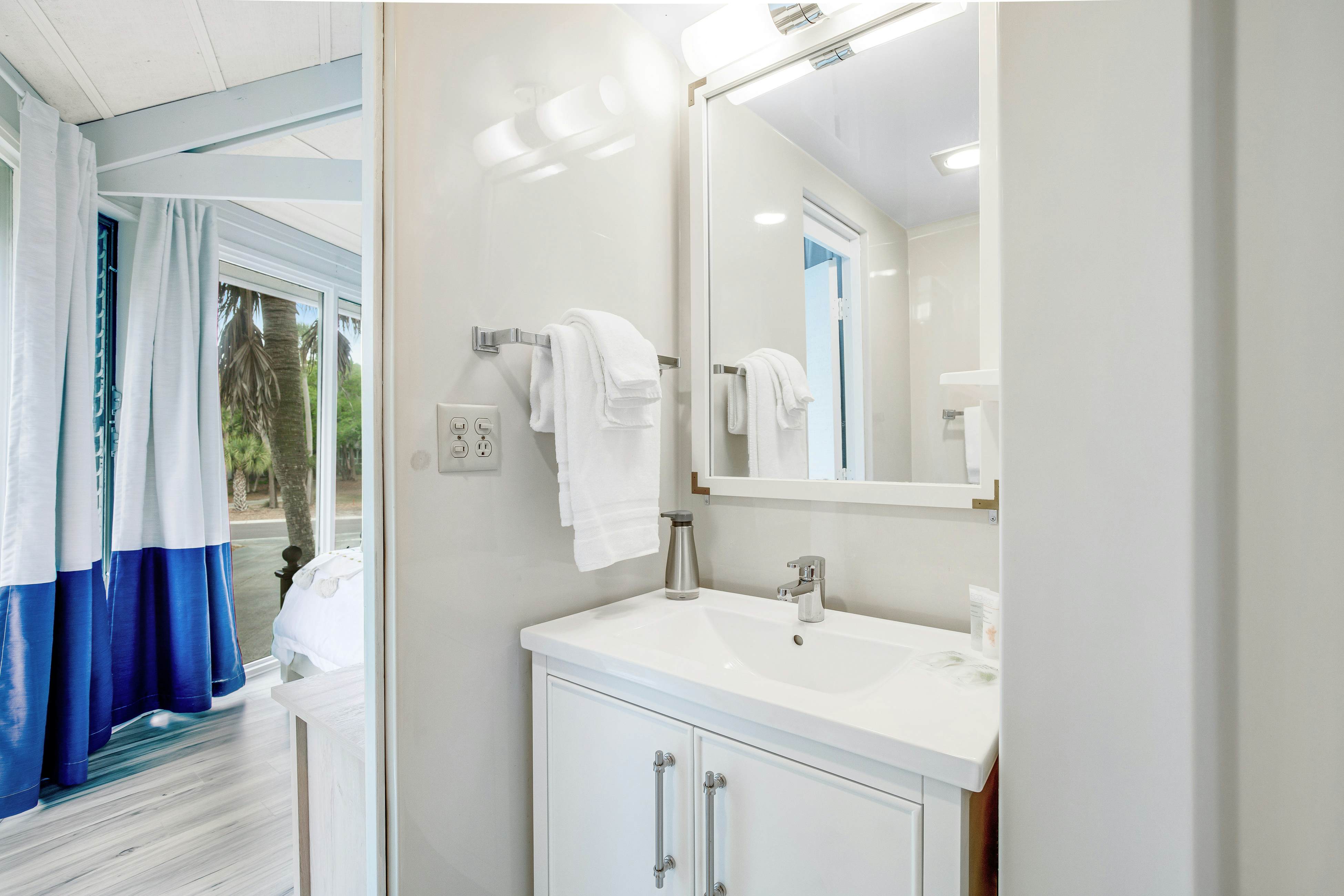 Lakefront home with lagoon view, deck & AC - close to beach, golf, & pools