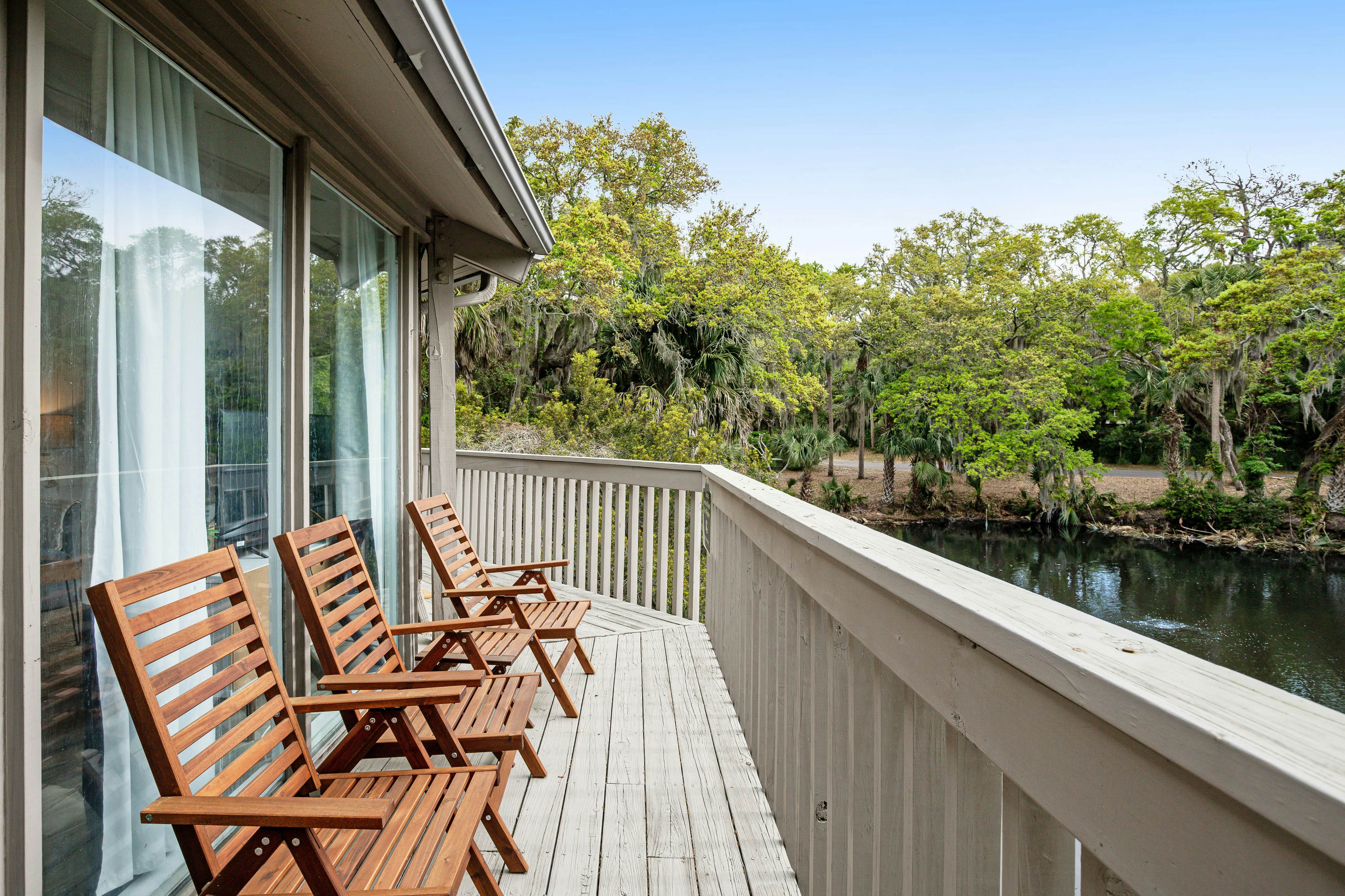 Lakefront home with lagoon view, deck & AC - close to beach, golf, & pools