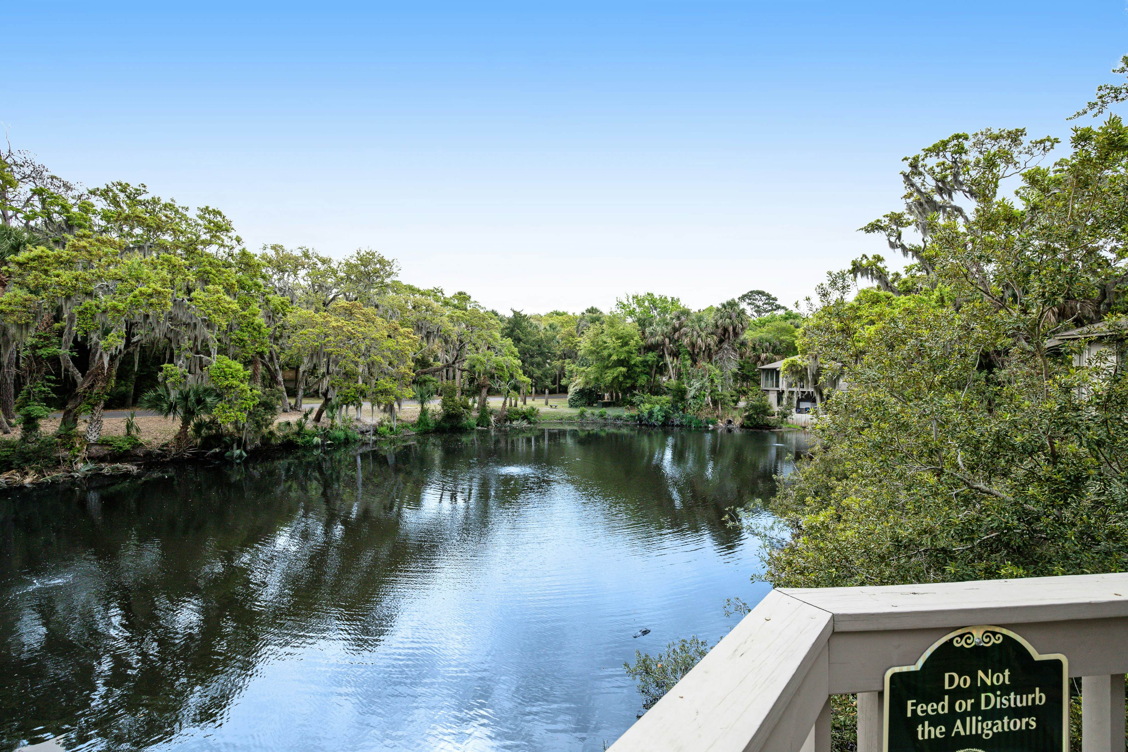 Lakefront home with lagoon view, deck & AC - close to beach, golf, & pools