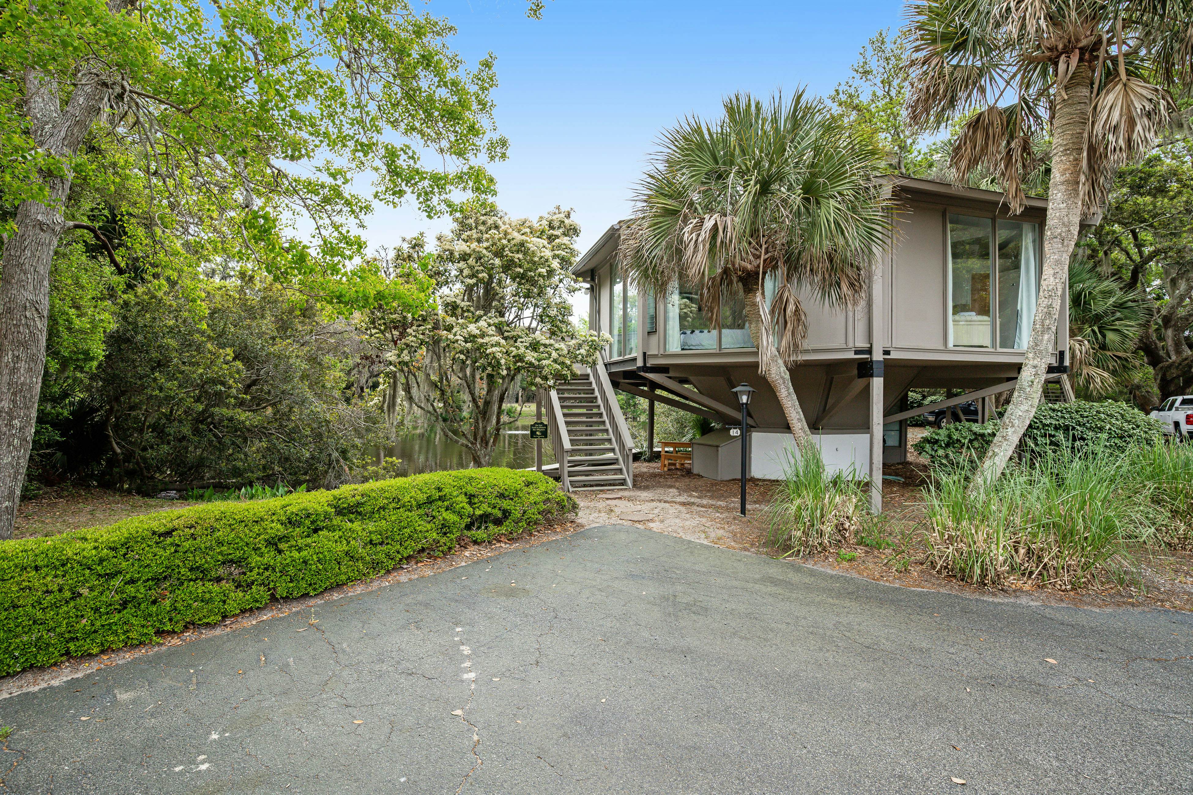 Lakefront home with lagoon view, deck & AC - close to beach, golf, & pools