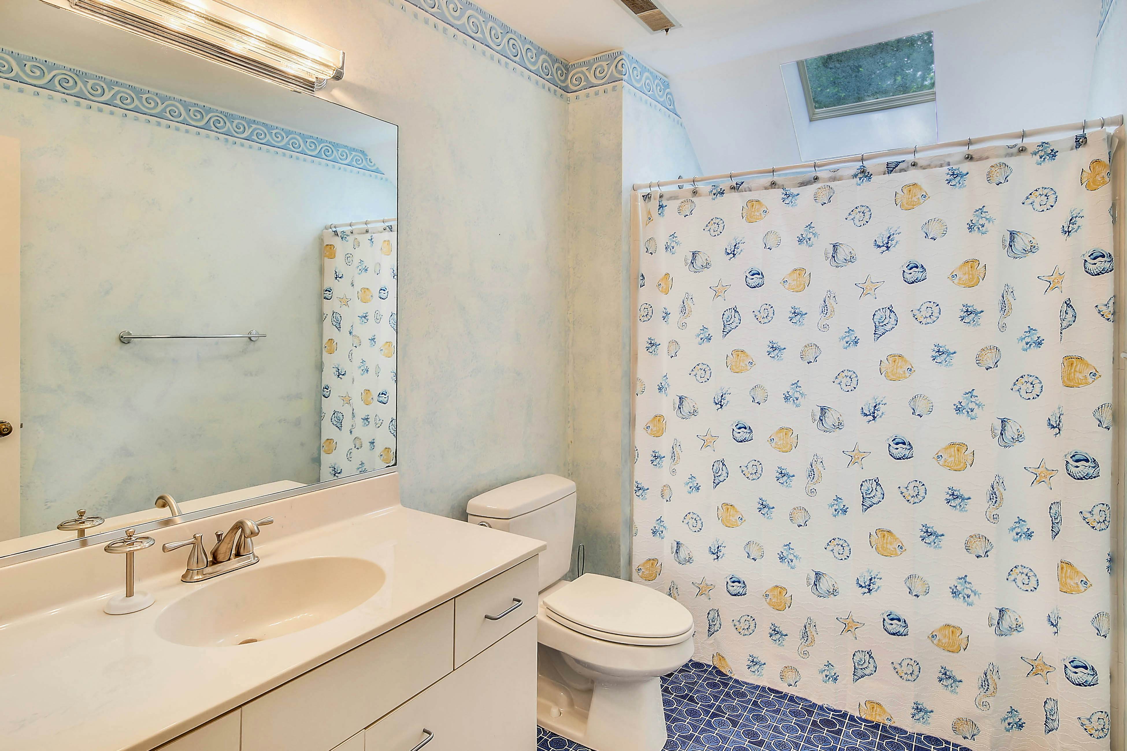 Dog-friendly home with large deck, on-site pools, tennis & Beach Club