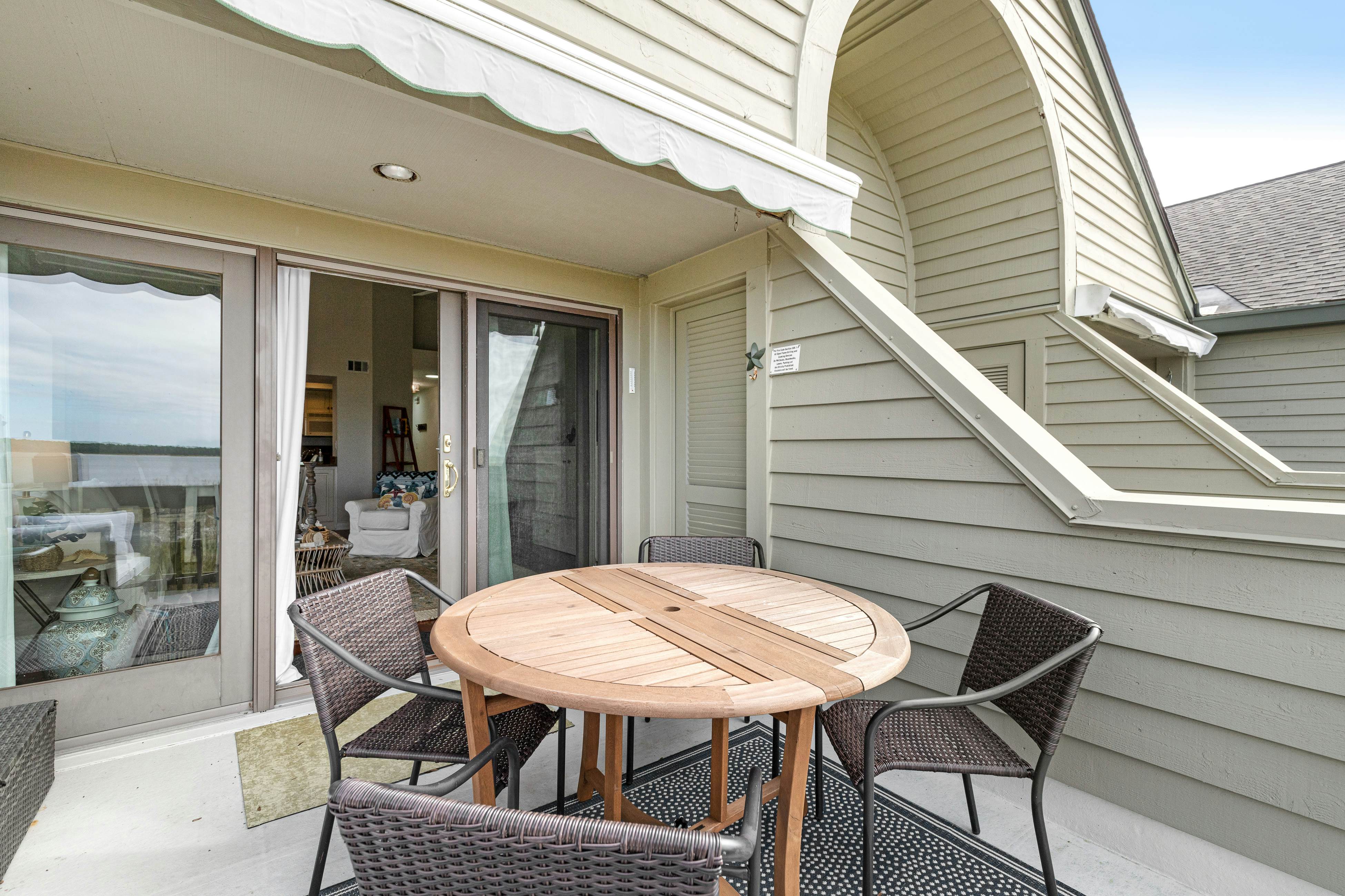 2nd floor villa with water views, lovely balcony & w/d - walk to Beach Club