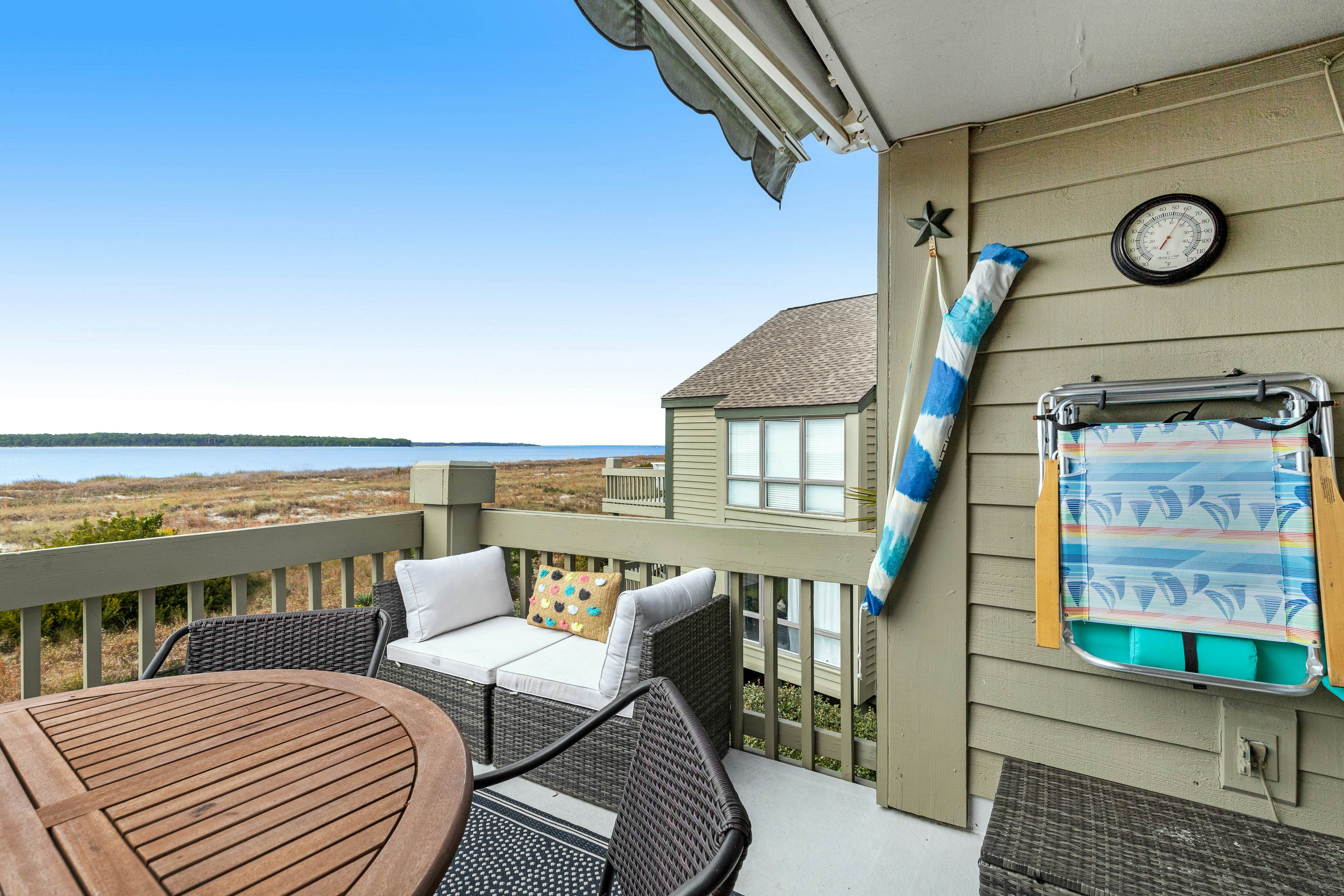 2nd floor villa with water views, lovely balcony & w/d - walk to Beach Club