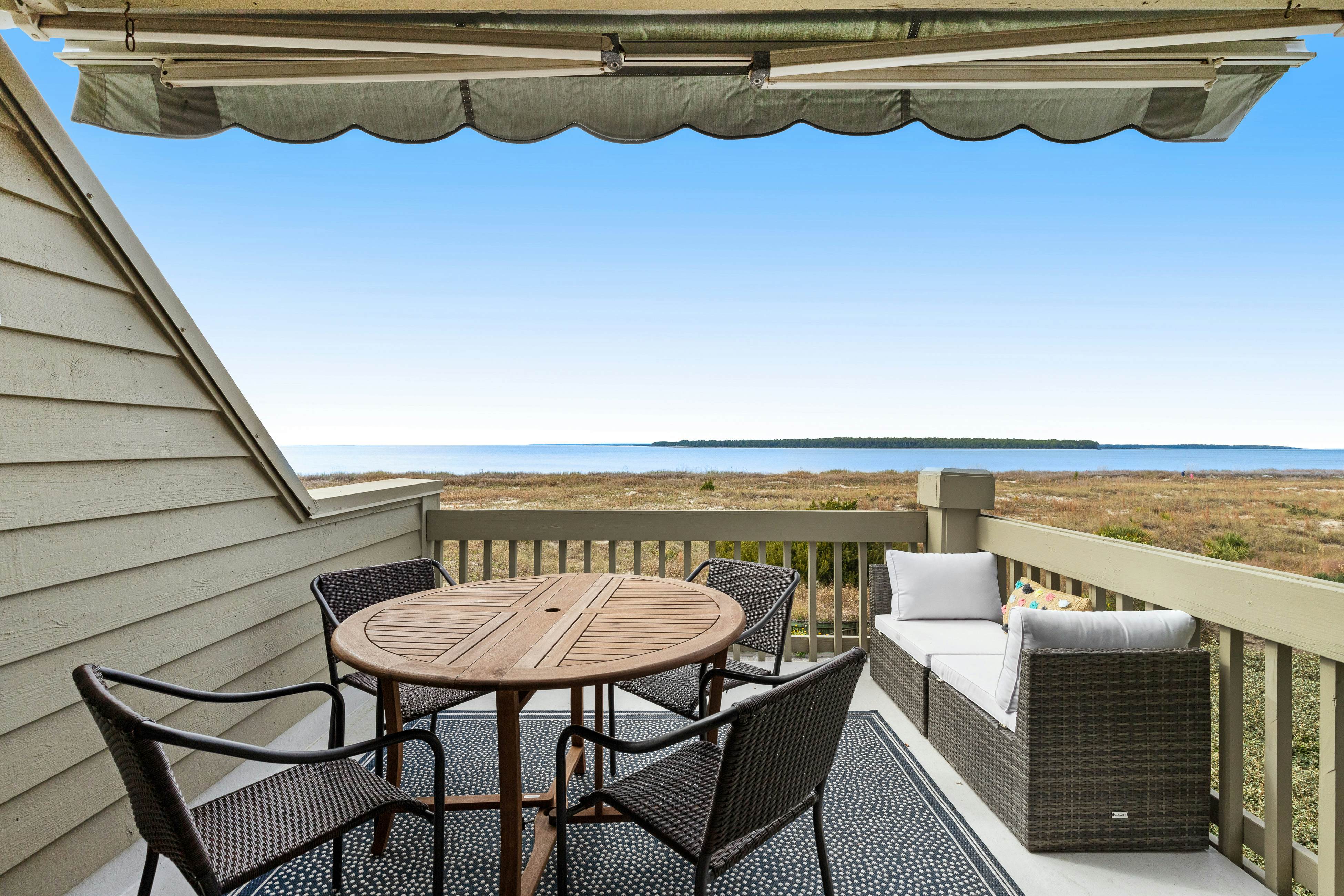 2nd floor villa with water views, lovely balcony & w/d - walk to Beach Club