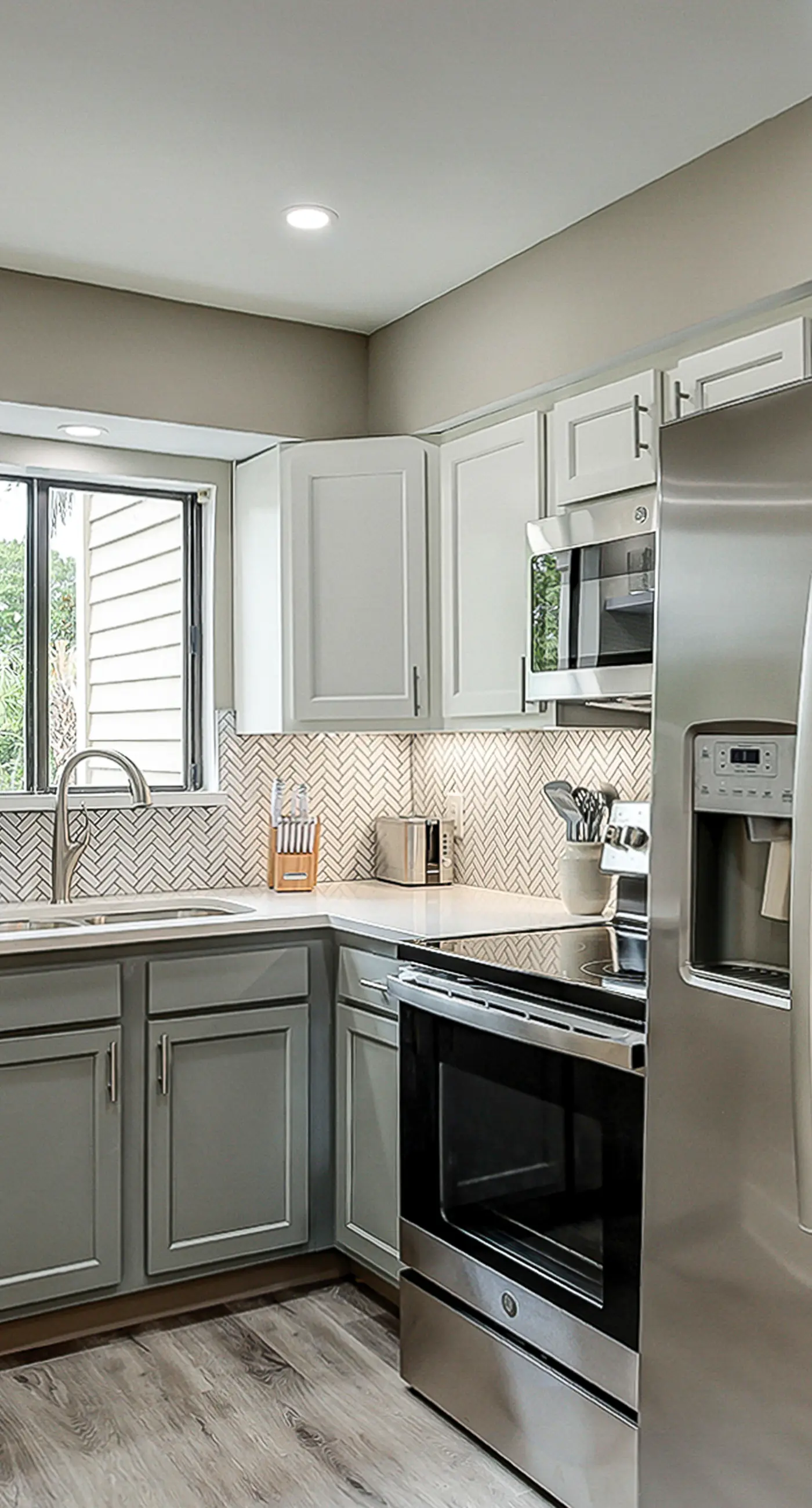 Fully updated condo with serene view, enclosed balcony, WiFi, W/D, pool, & gym