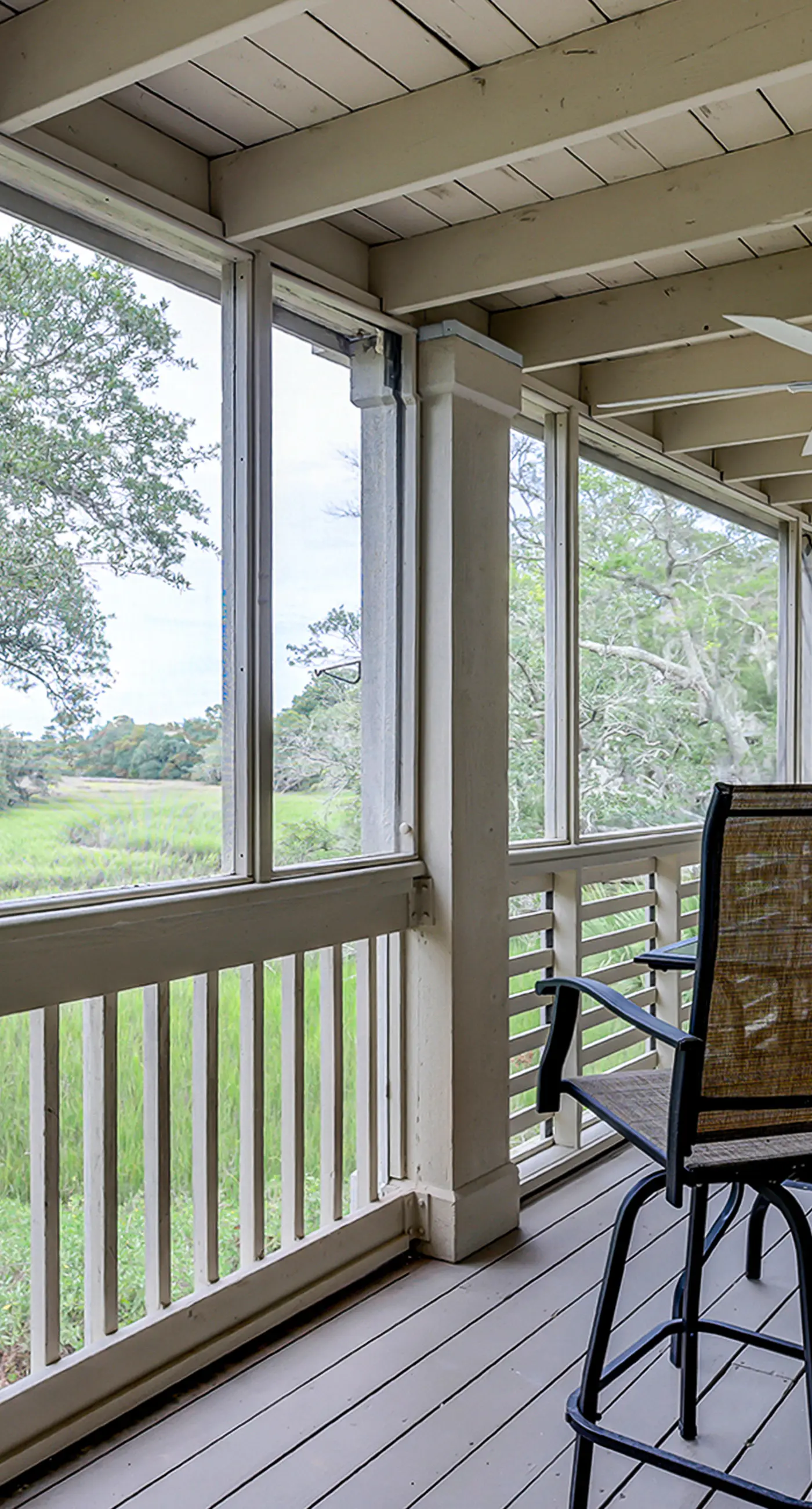 Fully updated condo with serene view, enclosed balcony, WiFi, W/D, pool, & gym