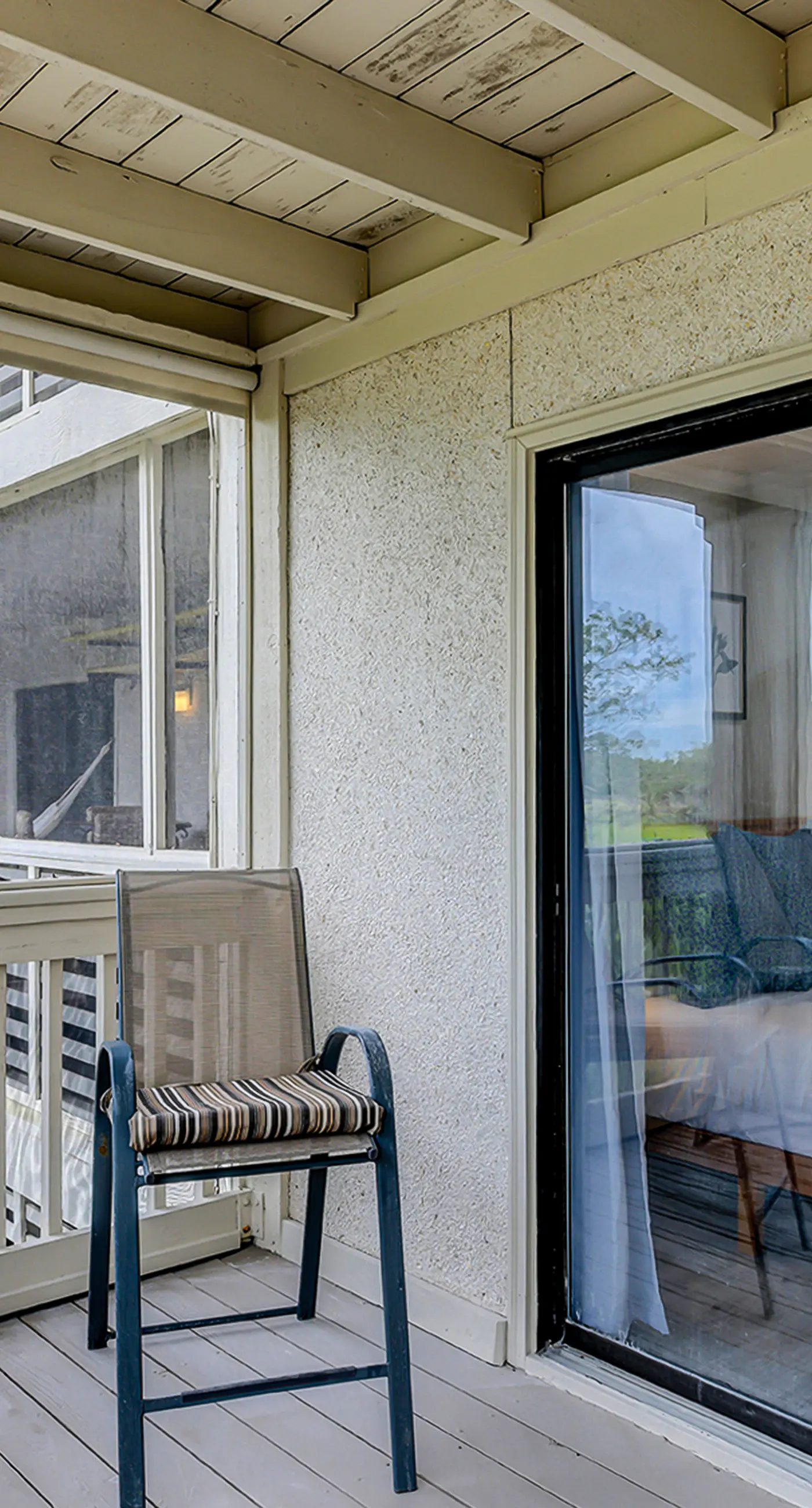 Fully updated condo with serene view, enclosed balcony, WiFi, W/D, pool, & gym