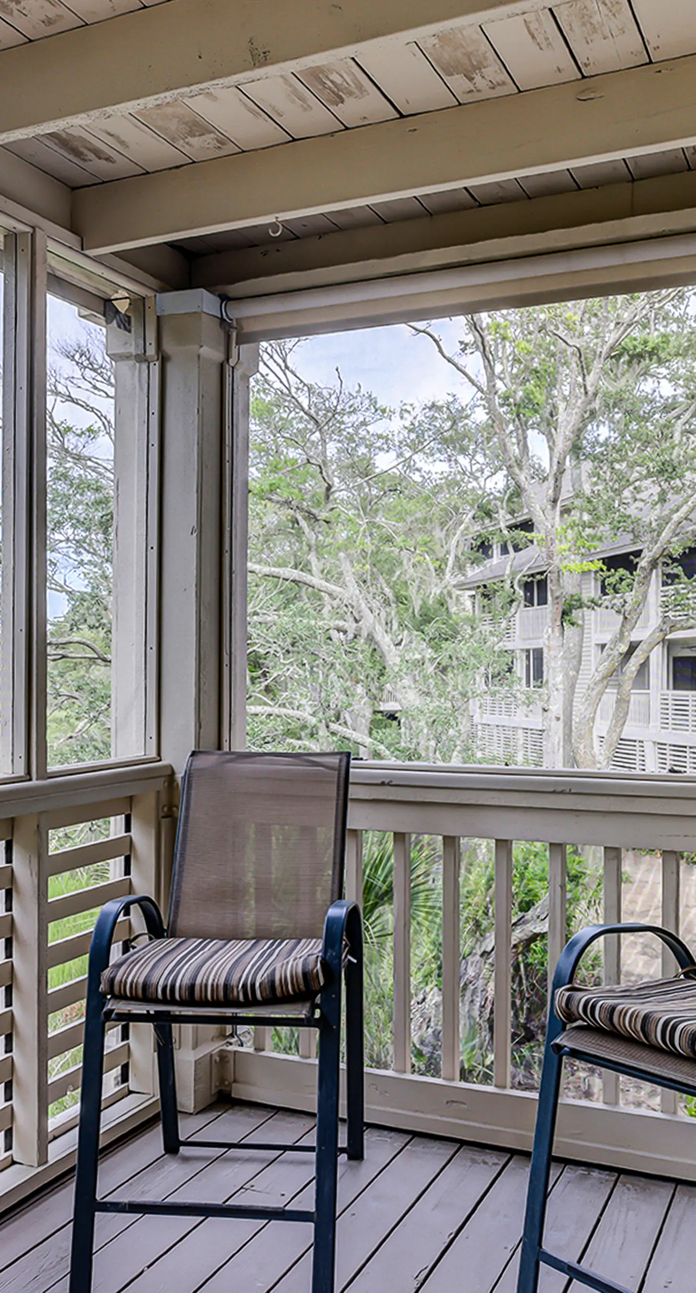 Fully updated condo with serene view, enclosed balcony, WiFi, W/D, pool, & gym