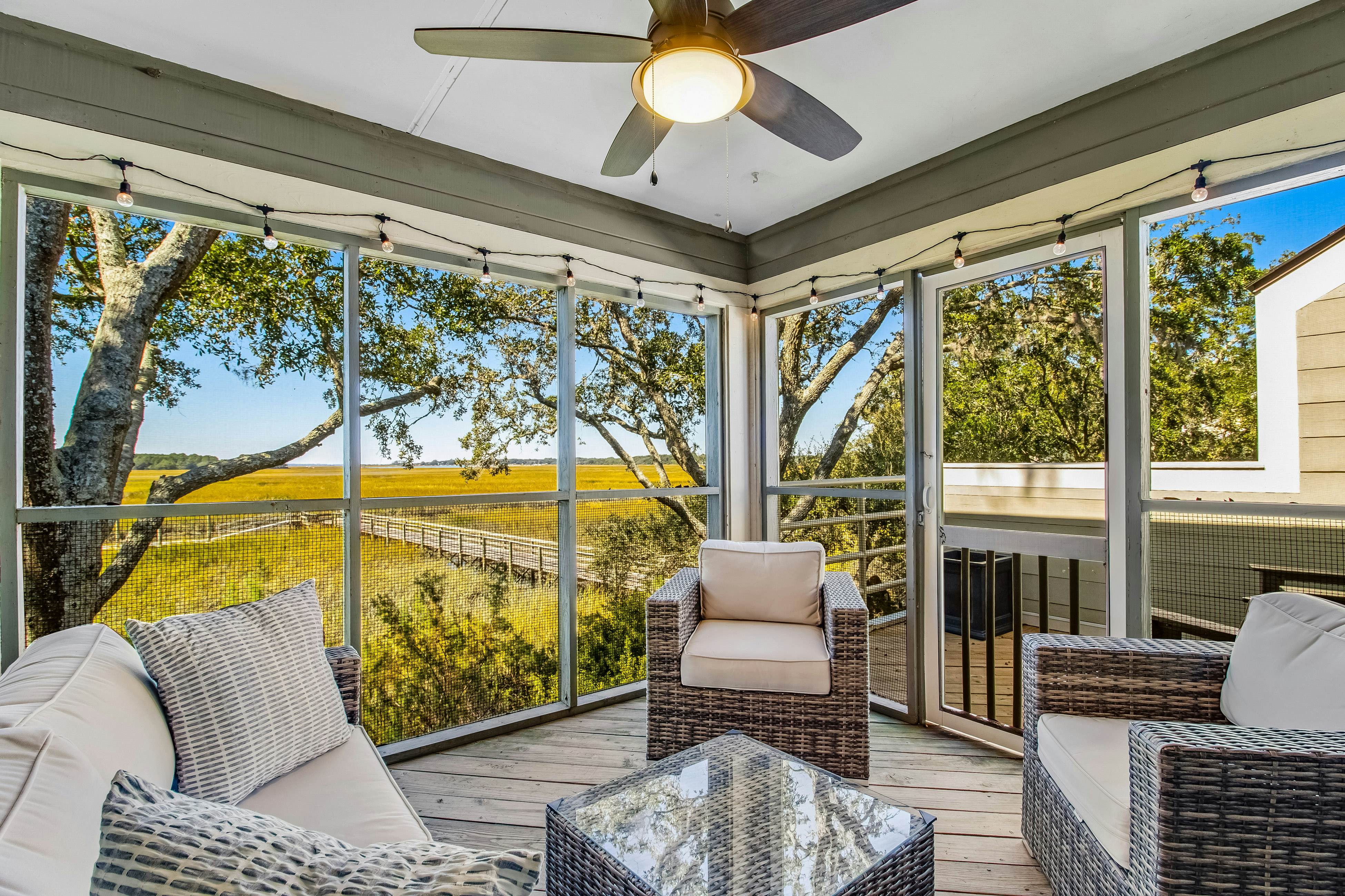 Three-level marsh-front villa with screened porch - walk to all amenities