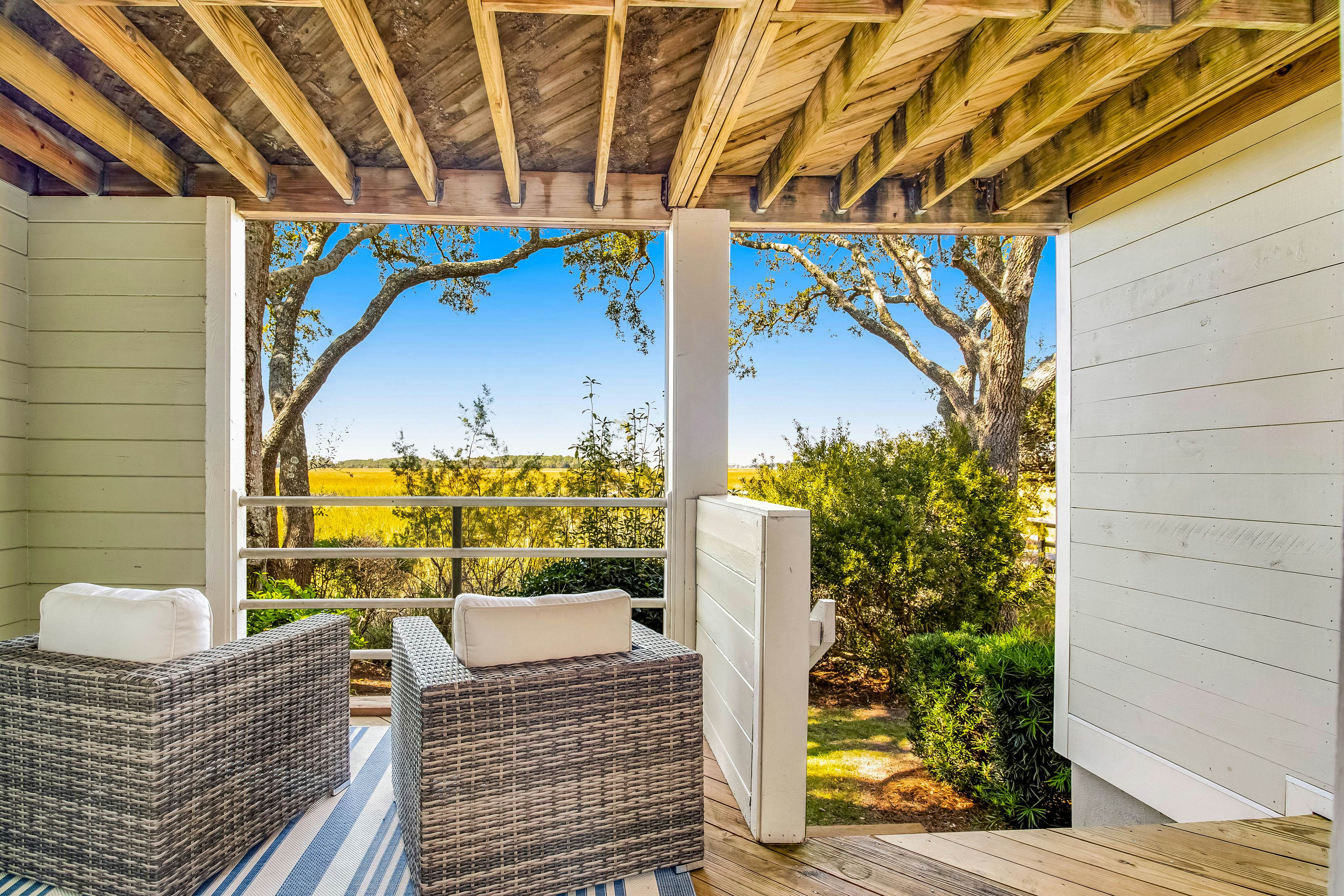 Three-level marsh-front villa with screened porch - walk to all amenities