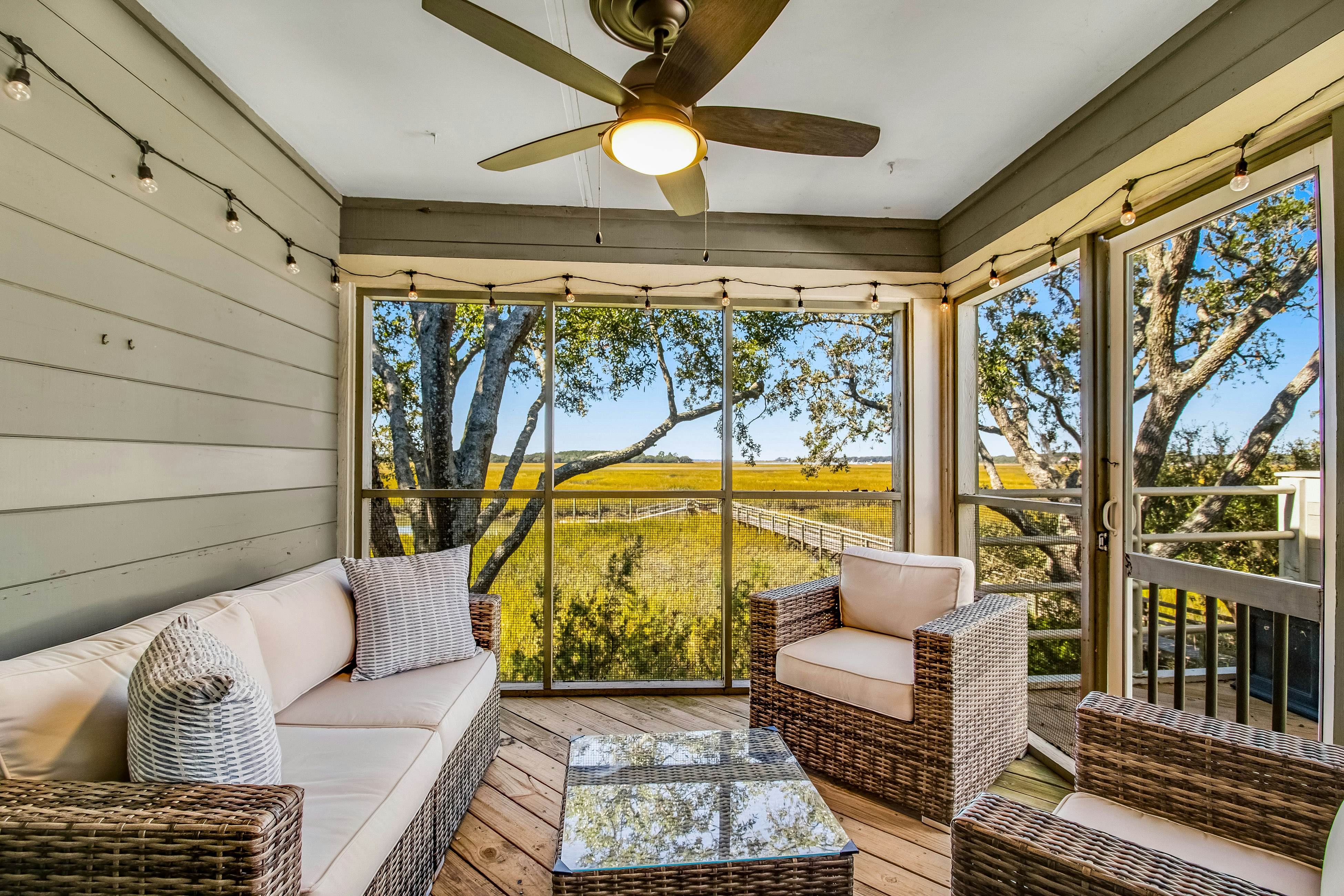 Three-level marsh-front villa with screened porch - walk to all amenities