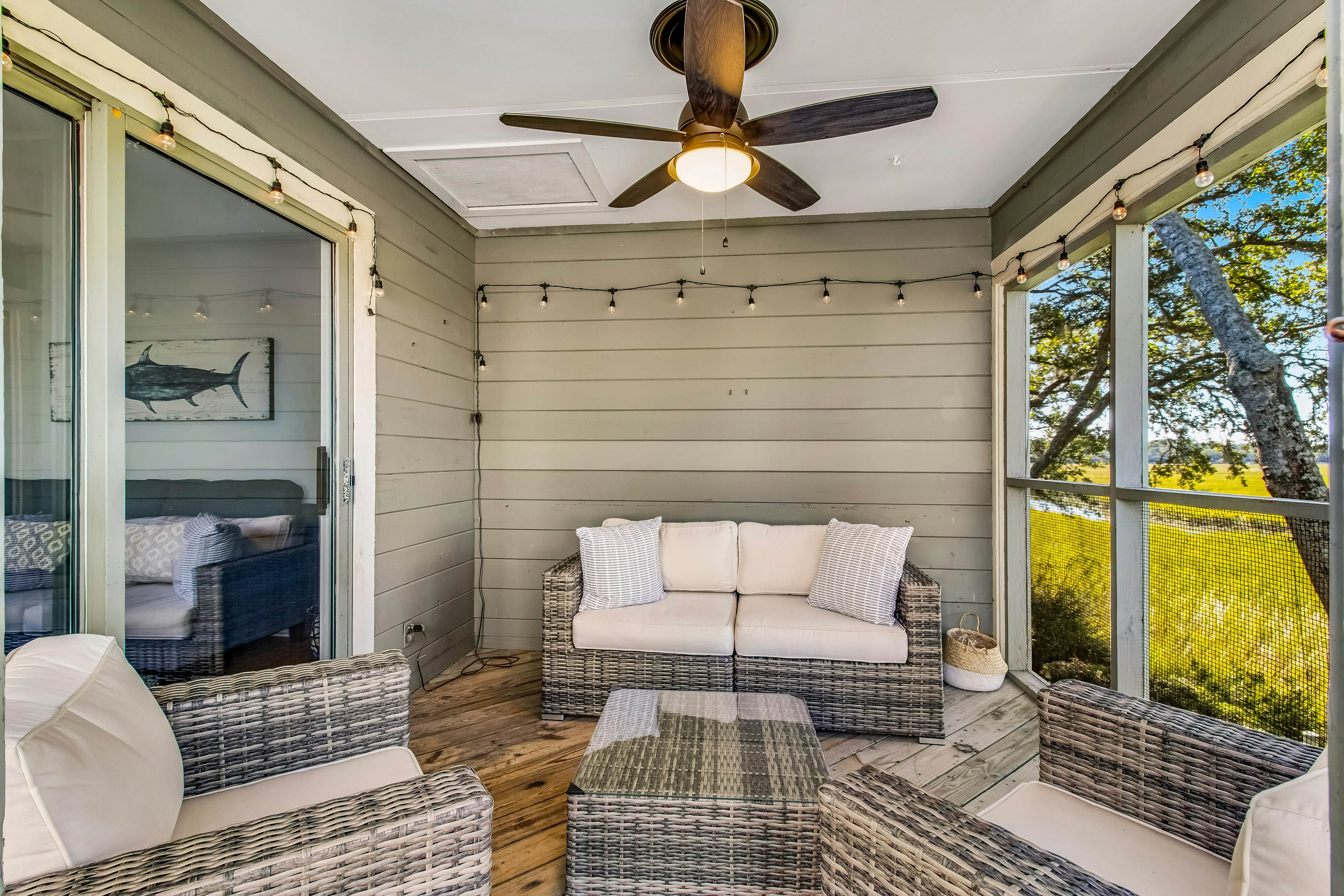 Three-level marsh-front villa with screened porch - walk to all amenities