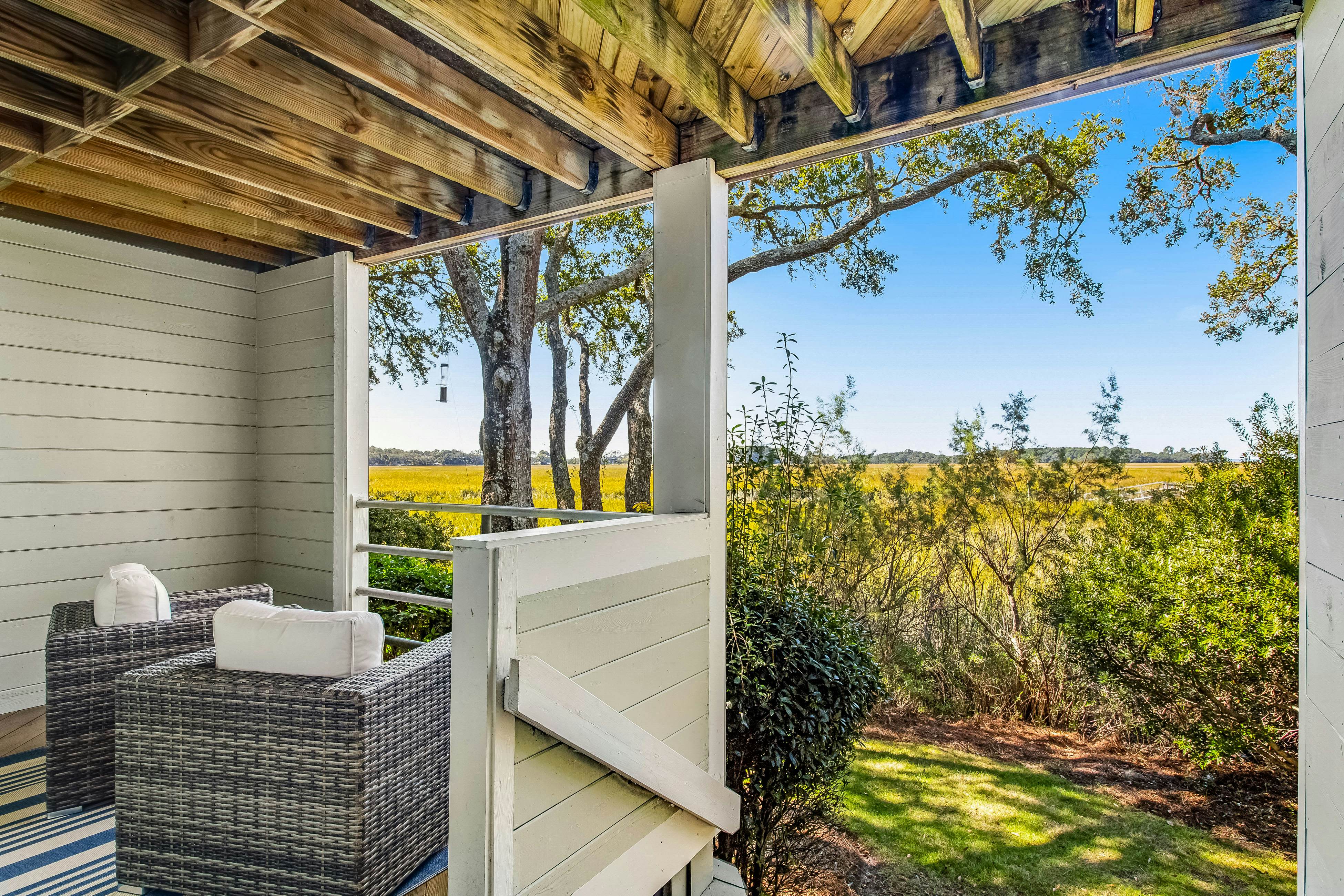 Three-level marsh-front villa with screened porch - walk to all amenities