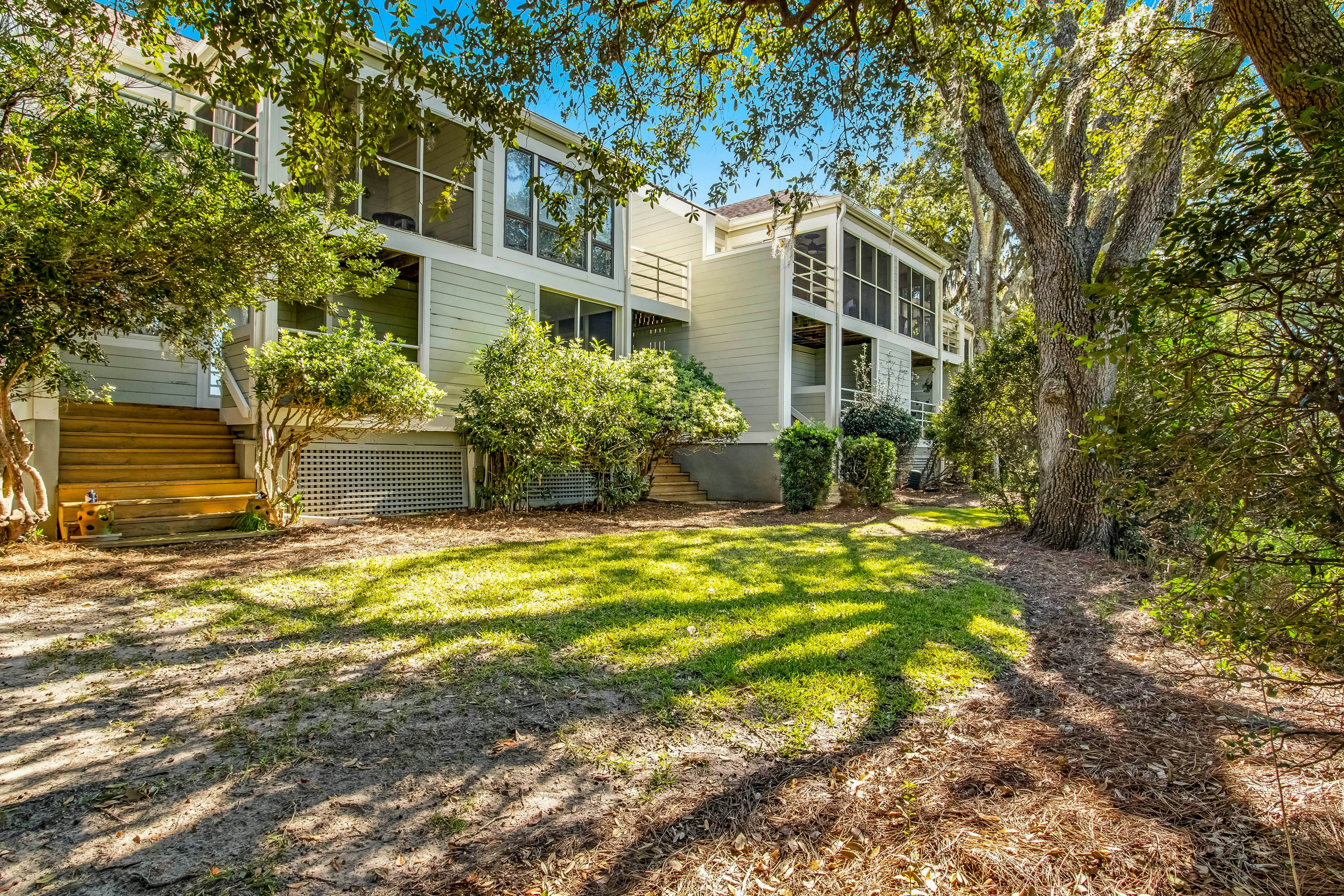 Three-level marsh-front villa with screened porch - walk to all amenities